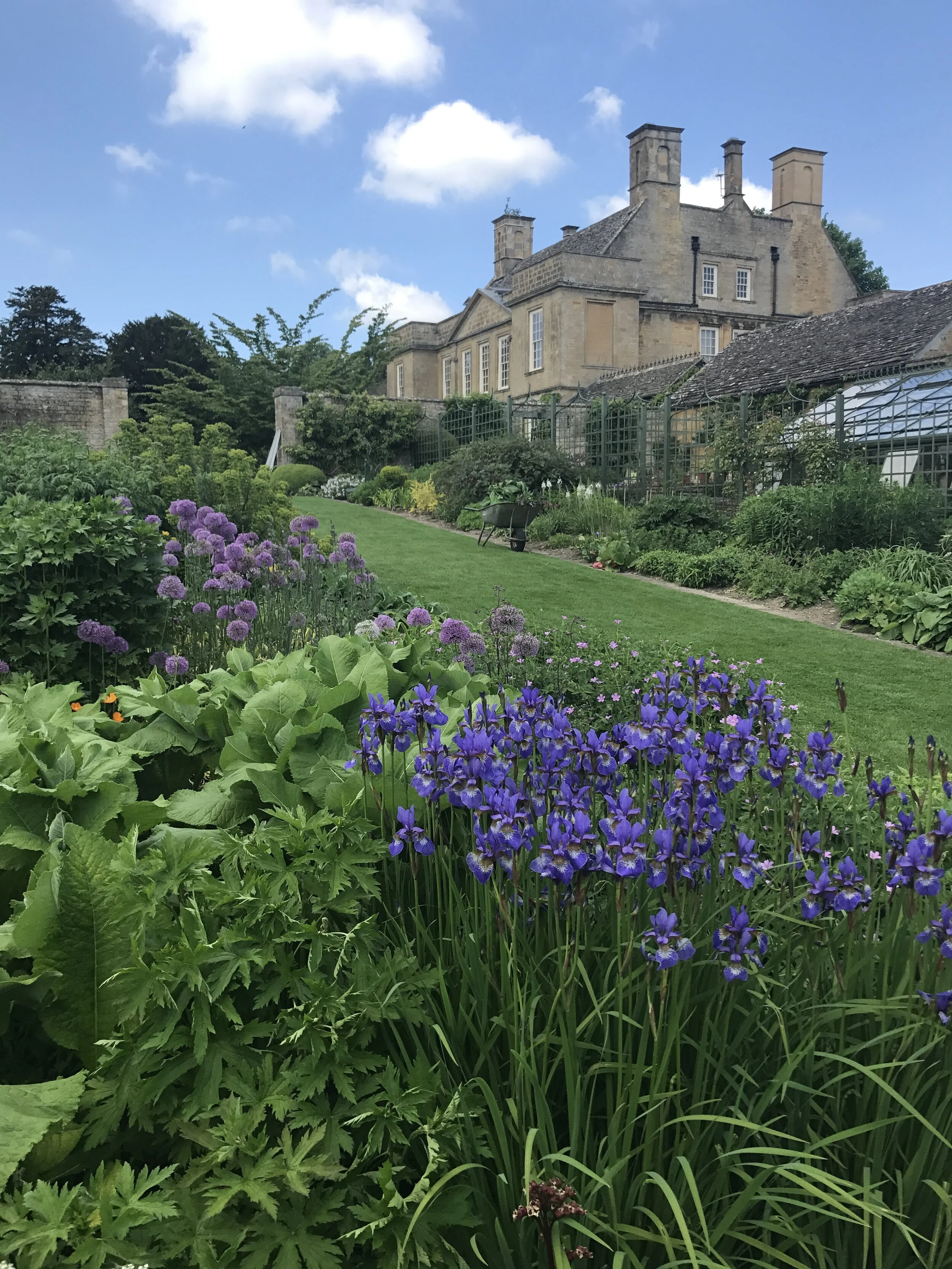 The House - a Georgian pile of golden Cotswold stone is often visible as you walk around the garden