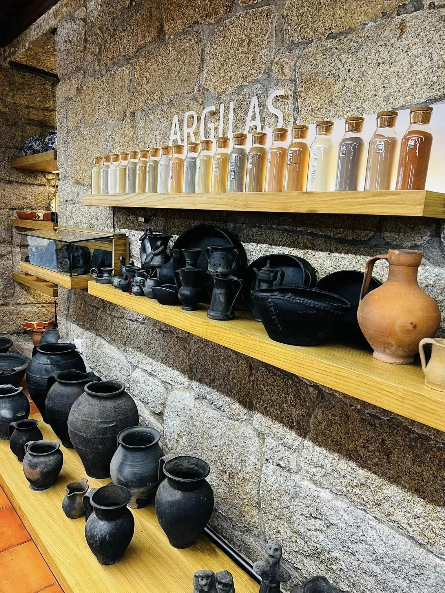 Pottery and clay vessels on display at the Idades da Terra museum in Cumieira.