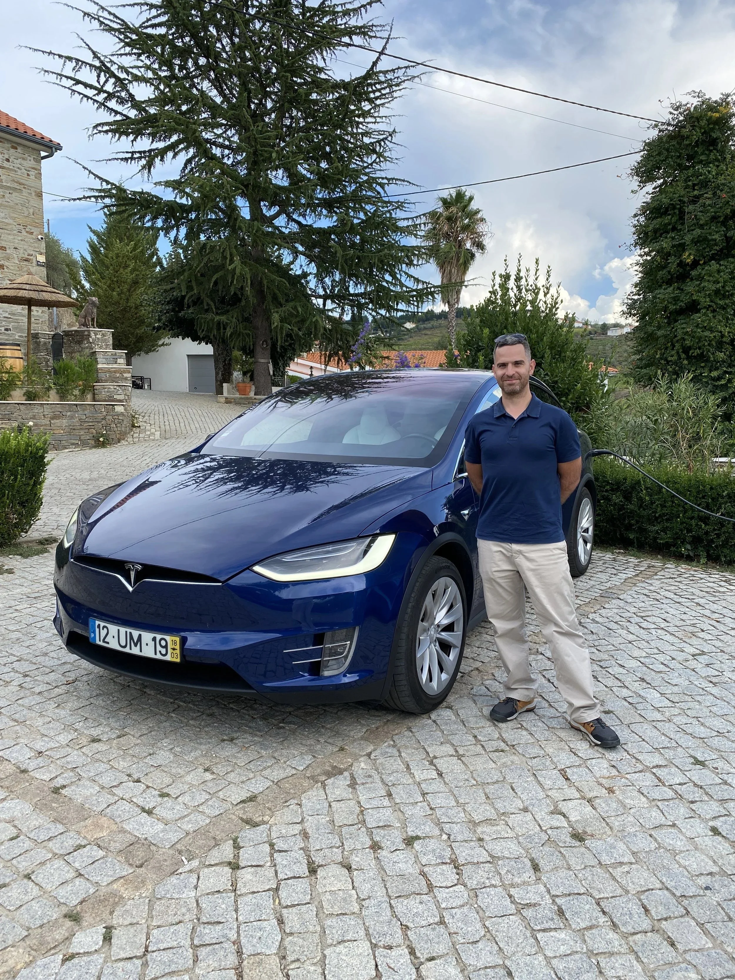 Sérgio Costa, founder of Portugal EV Tours, with the Tesla Model X.