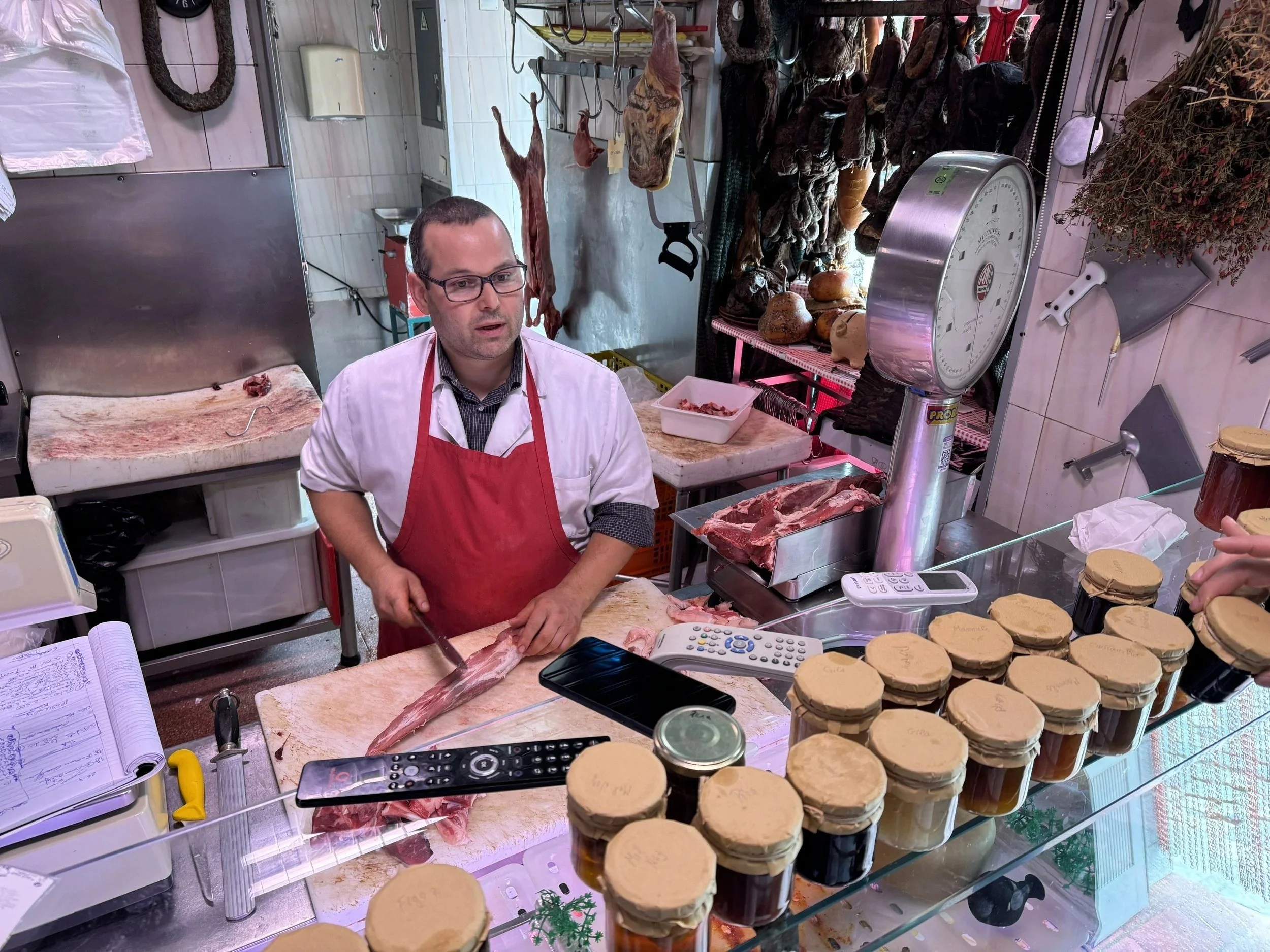 The butcher at Qualifer in Pinhão preparing meat for the cooking class.