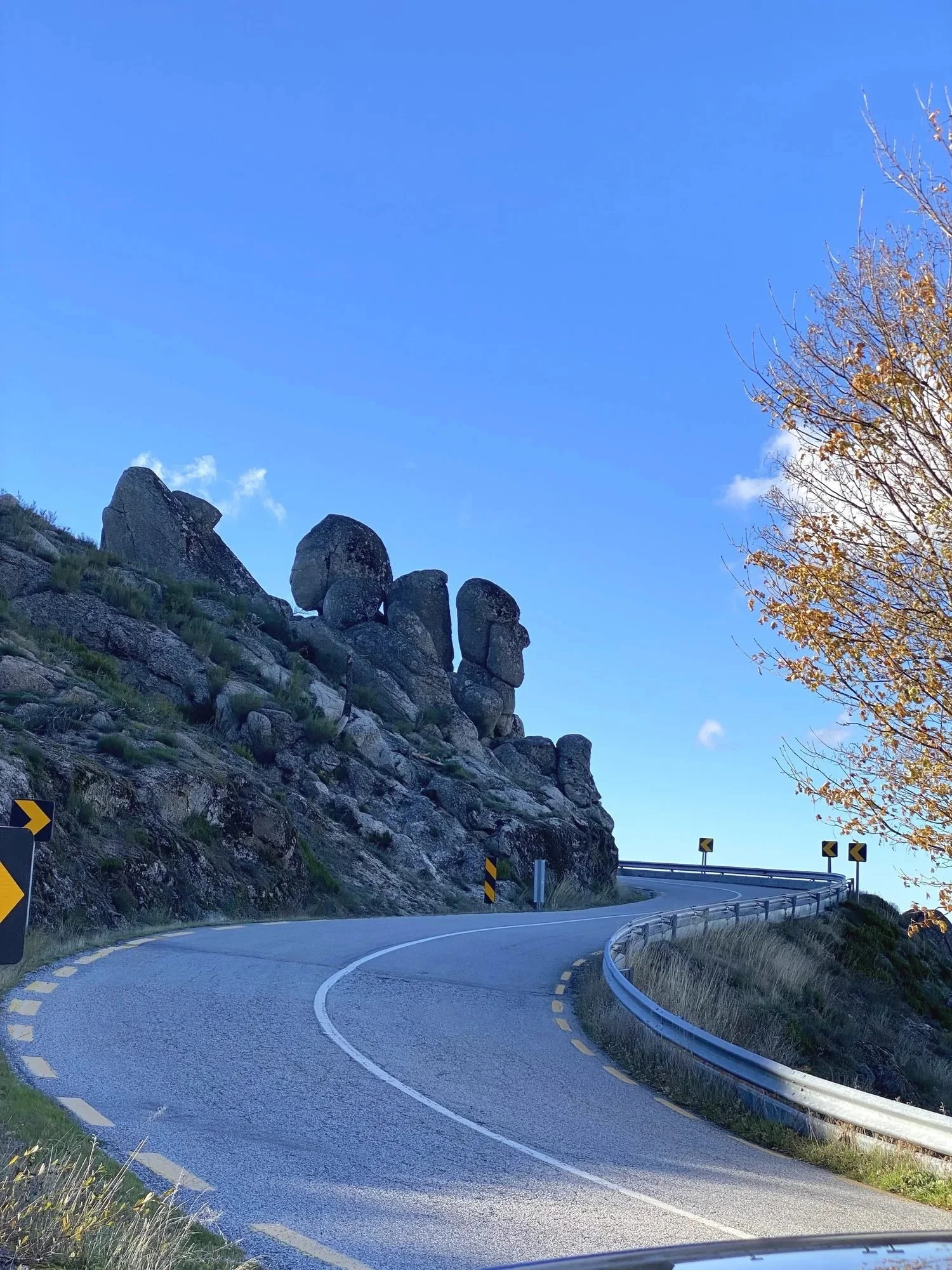 A mountain road past granite rocks in the Serra da Estrela