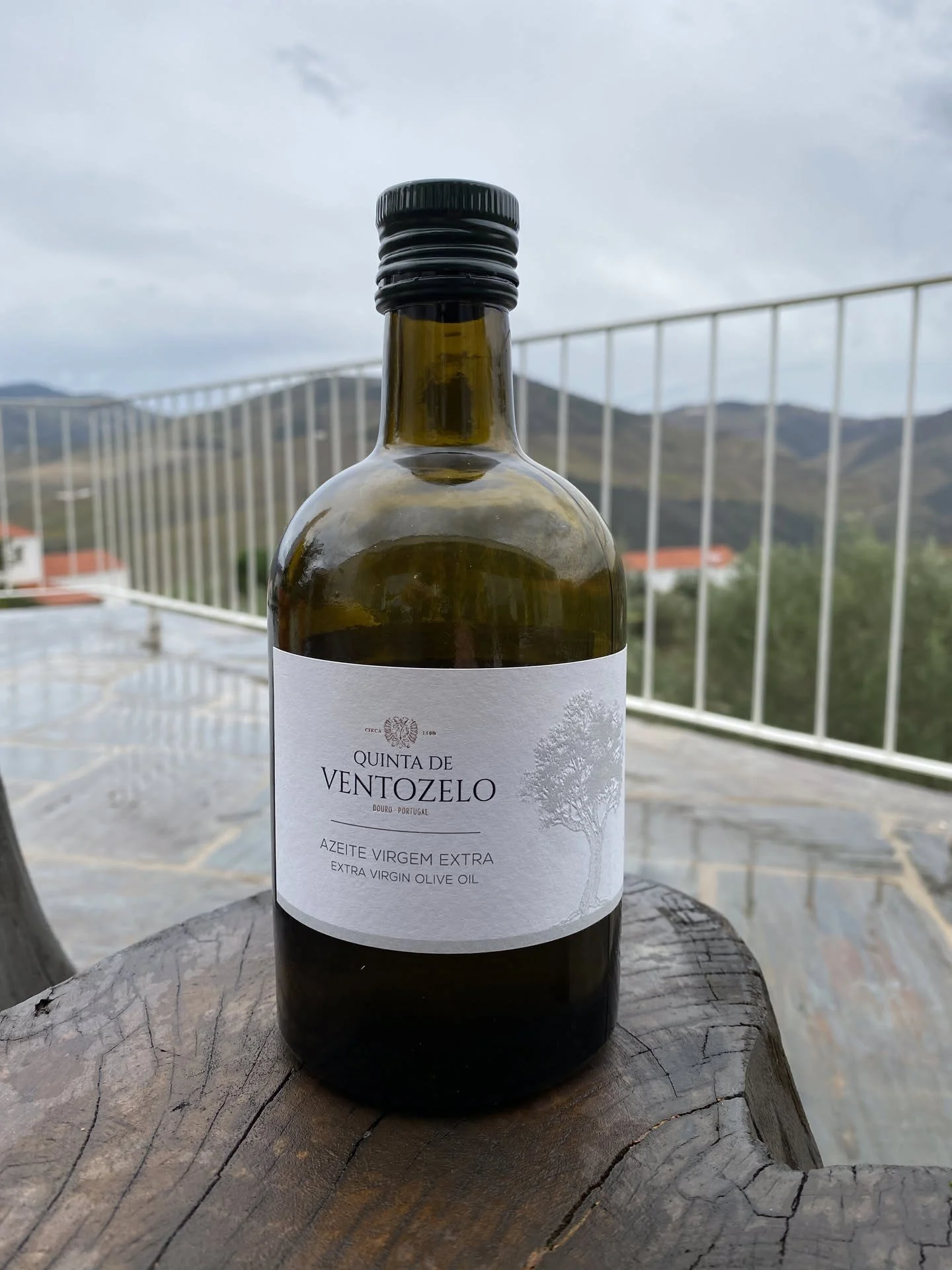 A bottle of Quinta de Ventozelo olive oil on a terrace above the Douro.