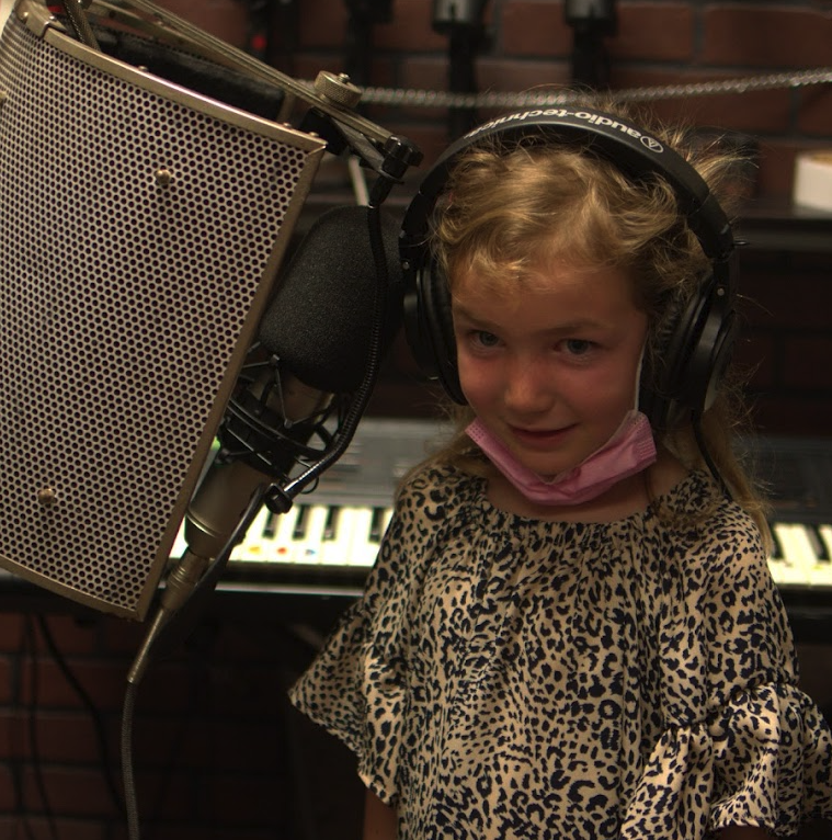 Singing and playing guitar during voice lessons near San Clemente