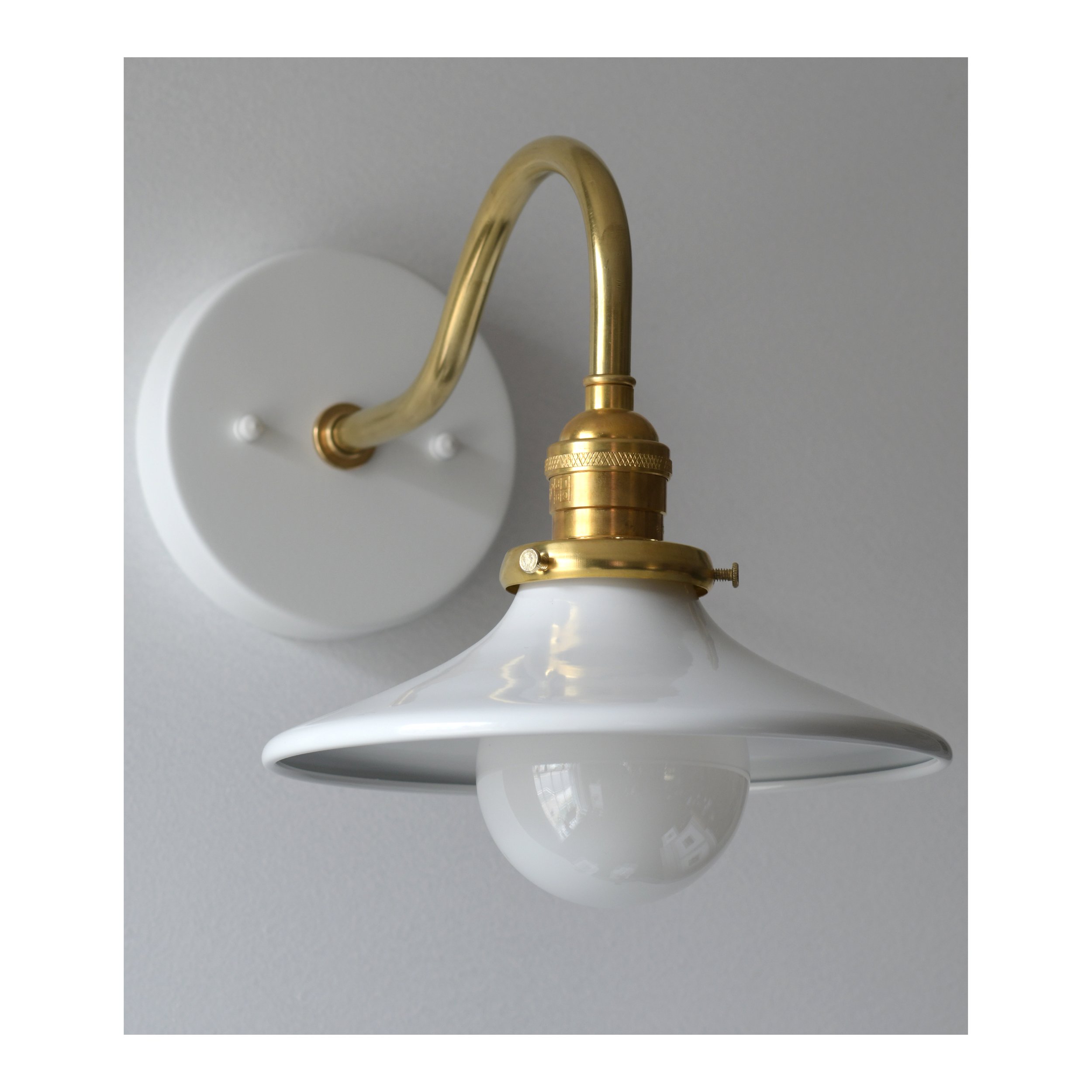 Brass- Curved arm sconce. ~ white backplate