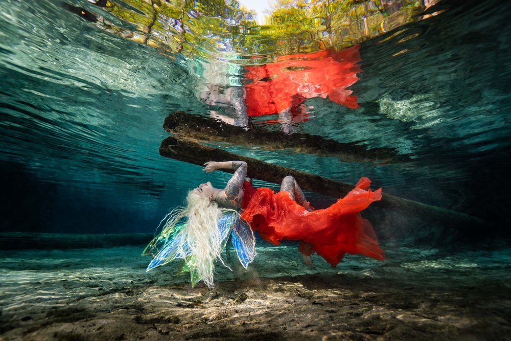 Underwater model in her fairy wings