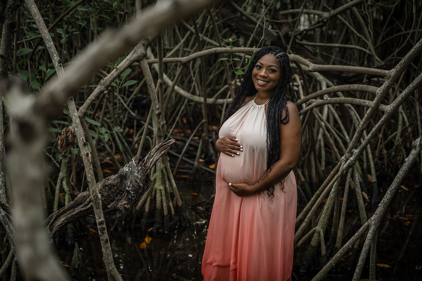 A pregnant woman posing for a Jungle Cenote photography in Tulum