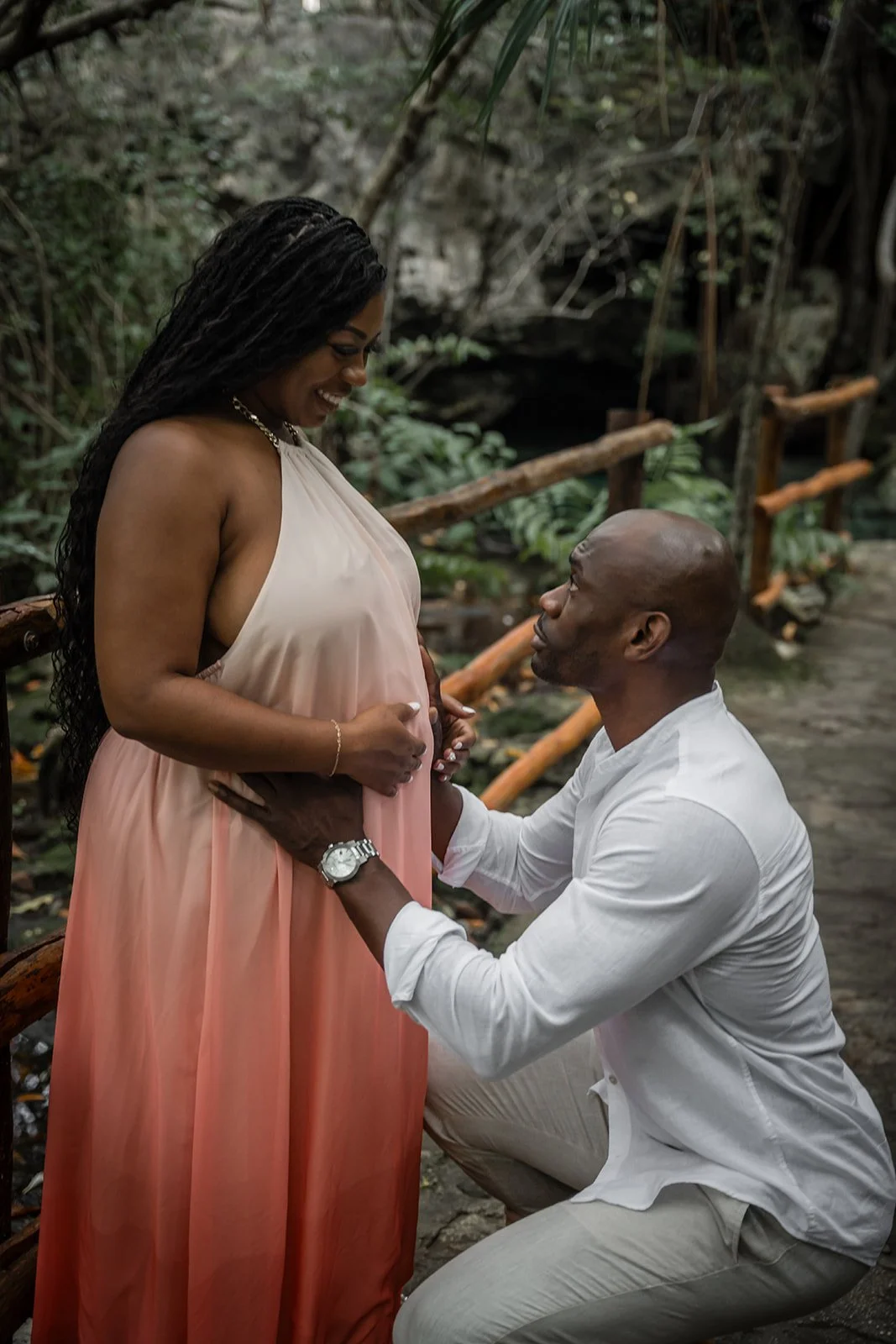A couple posing in a dress in Cancun in a Jungle photoshoot