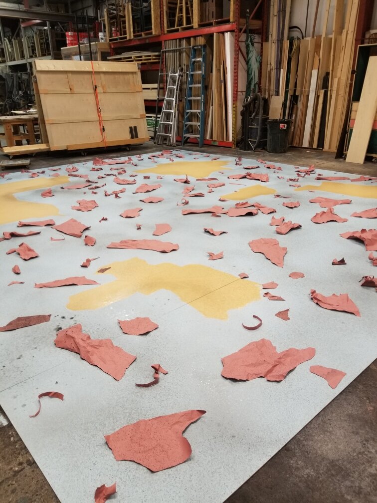 In process of the floor for Howl's Moving Castle with Book-It Reperatory Theatre. Under direction of Jessica Christensen.
The craft paper was used to create textured spots while spraying misted paint.