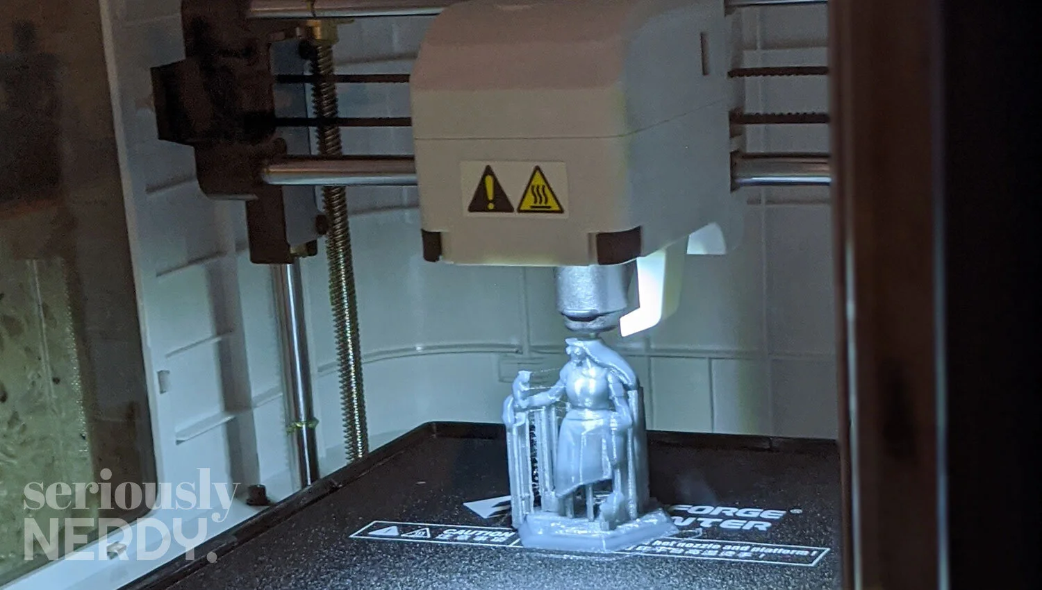 Dani used the Hero Forage tools to design and purchase a mini version of herself. She holds a squirrel and a bottle of bourbon. It was pretty on-brand for her.