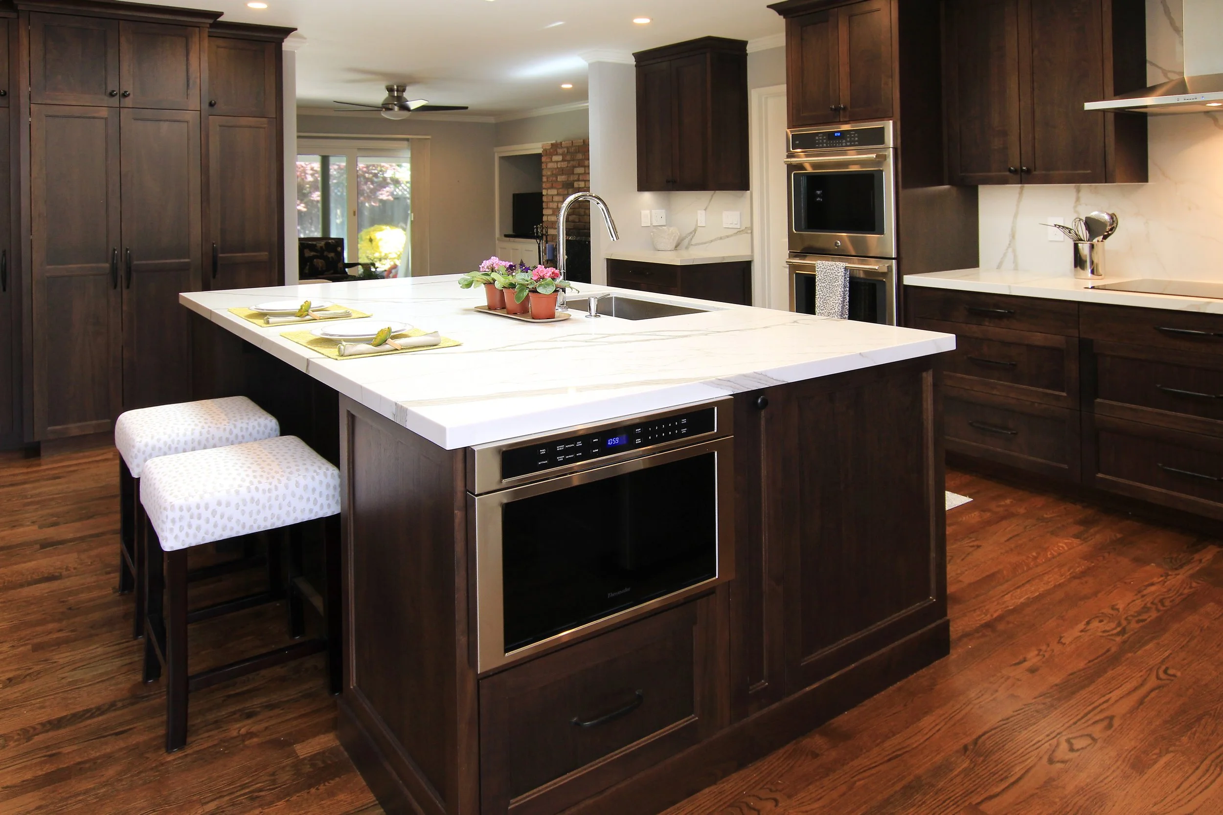 Completed luxury kitchen remodel in Santa Cruz County featuring custom cabinetry and large island.