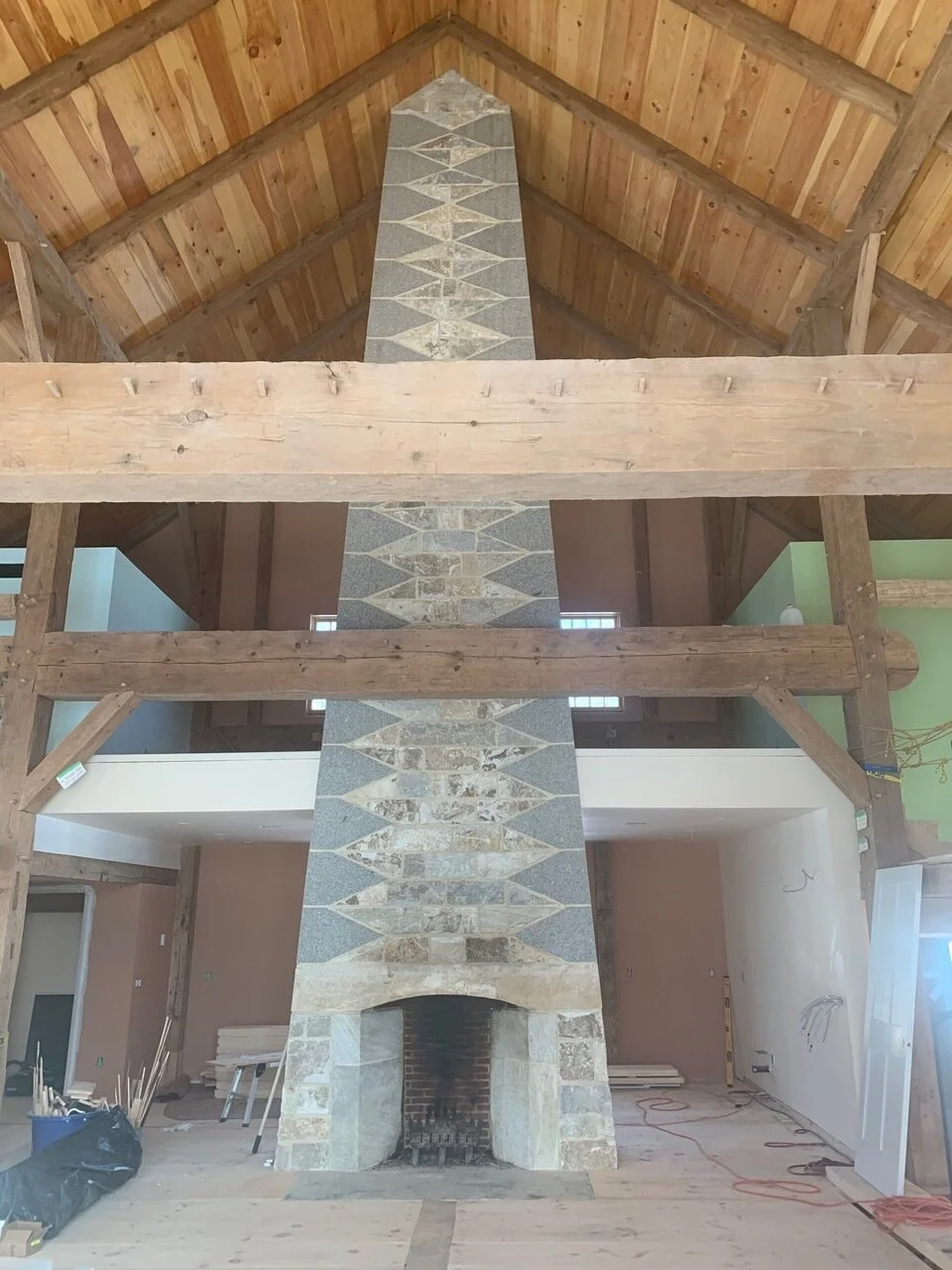 Unzipping the Obelisk, 2020 Granite and reclaimed marble, 46’ x 8’ x 32” Installed in Massachusetts Residence, Timber frame built from a Dutch Barn in Central New York, Circa 1802. Construction Photo: Mark Mendel