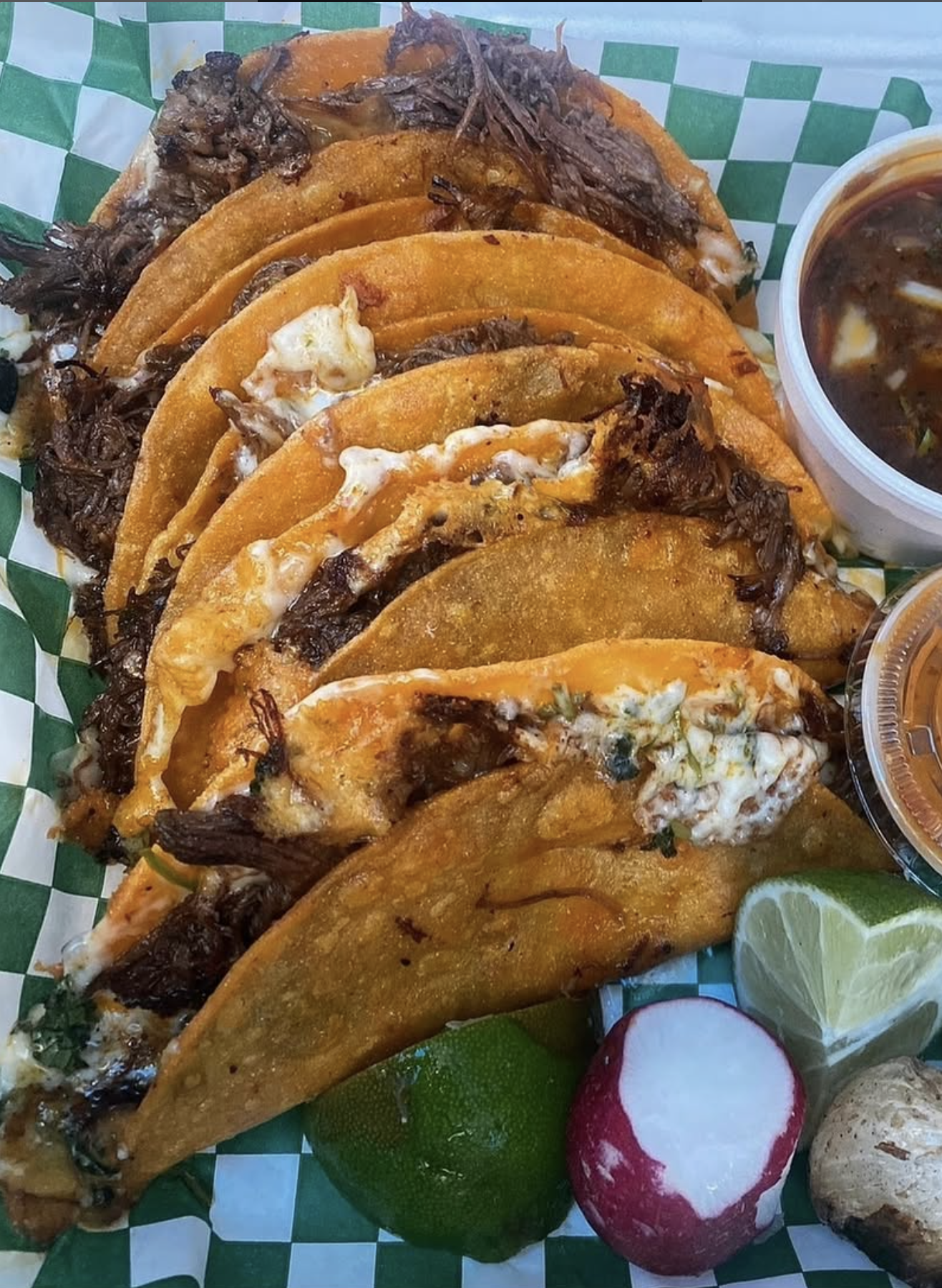five birria tacos with a side of consome from Tacos Mexico in Vallejo