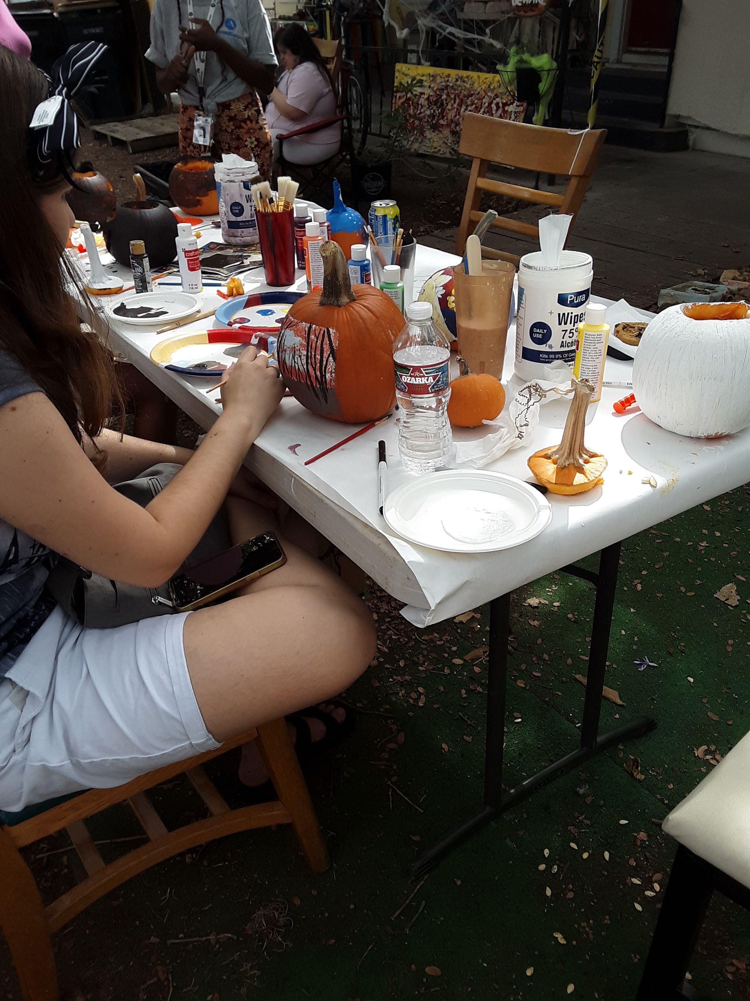 Courtney paints pumpkins.jpg