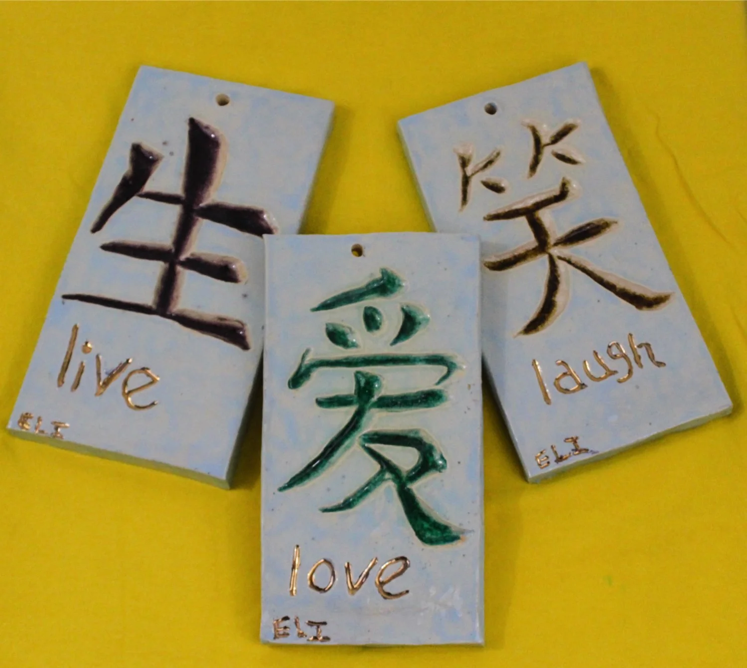 "Live, Laugh, Love" by Eli Davis, Ceramic Plaques, 8.5 x 4.25 x 0.5, Set of Three ($75)