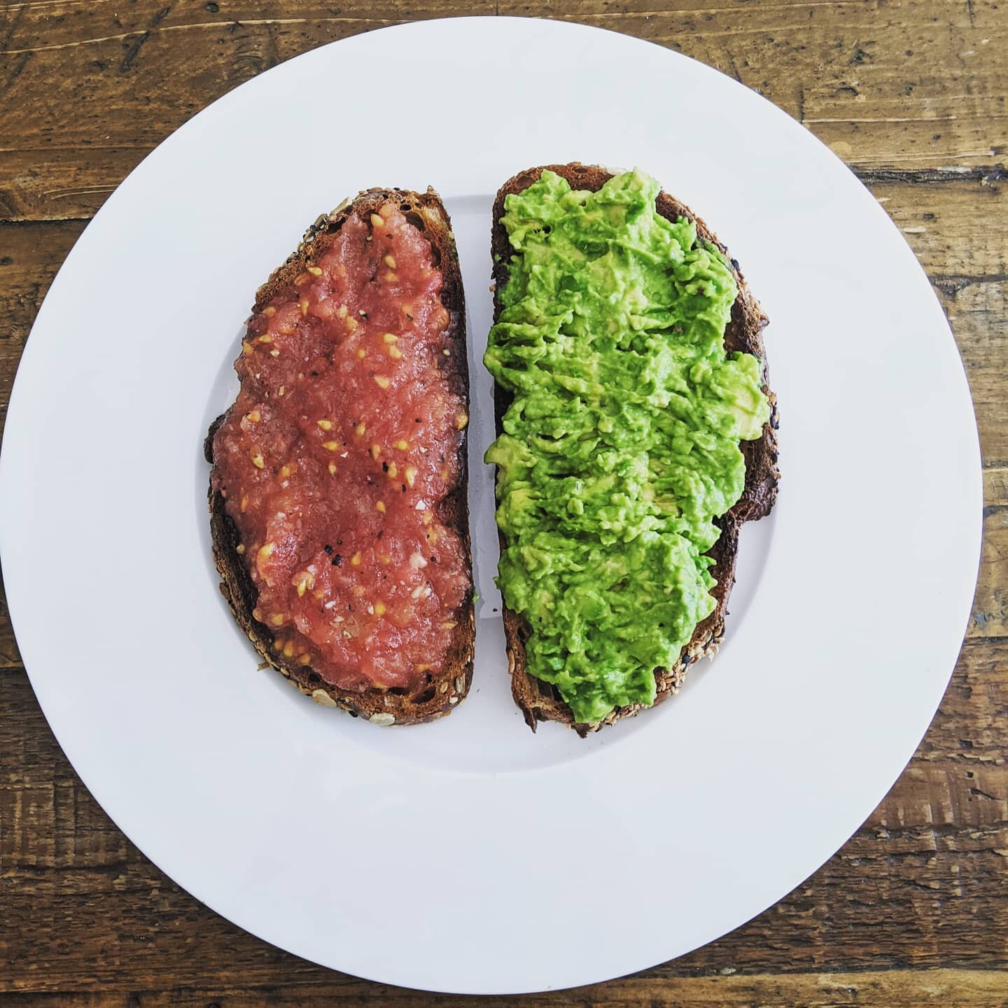 Tomato toast &amp; Avocado toast on @brodflour
Bird Seed Loaf, hard toasted to stand up to the liquid of the tomato toast.

Tomato toast:
3 tomatoes, scored, blanched, peeled &amp; grated
1 clove of garlic, microplaned
Olive oil
Salt &amp; Pepper

Av
