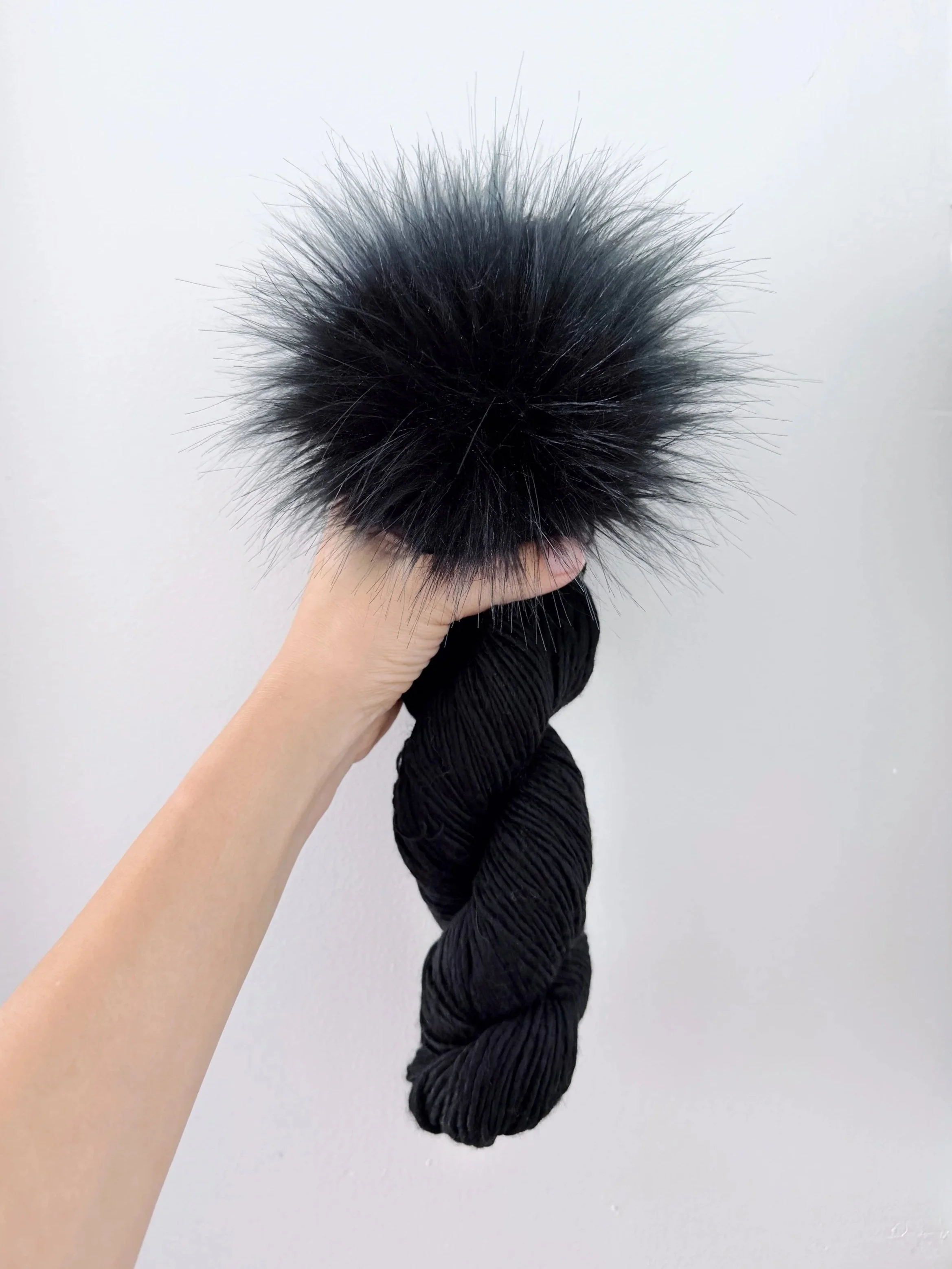 Malabrigo Mecha in Black + Jet Pom