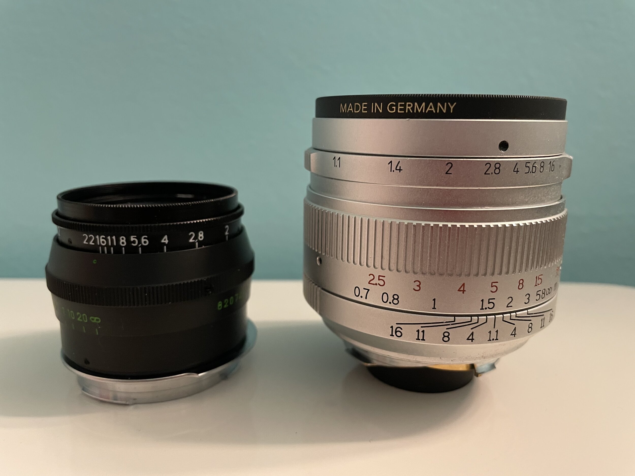 The orange filter is made in Germany, the lens is made in China. the size comparison is what’s important. On the left , a 1982 KMZ Jupiter 8 50mm. On the right, the 2019 7Artisans 50mm f/1.1 .
