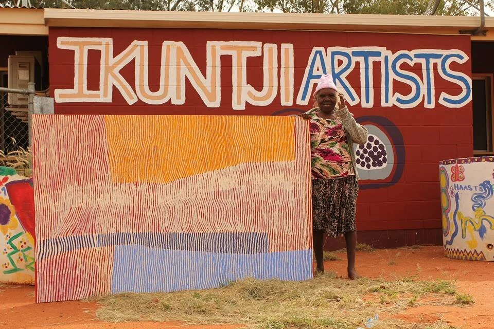 Eunice Napanangka Jack with her painting 'Kuruyultu'jpg-1.jpg