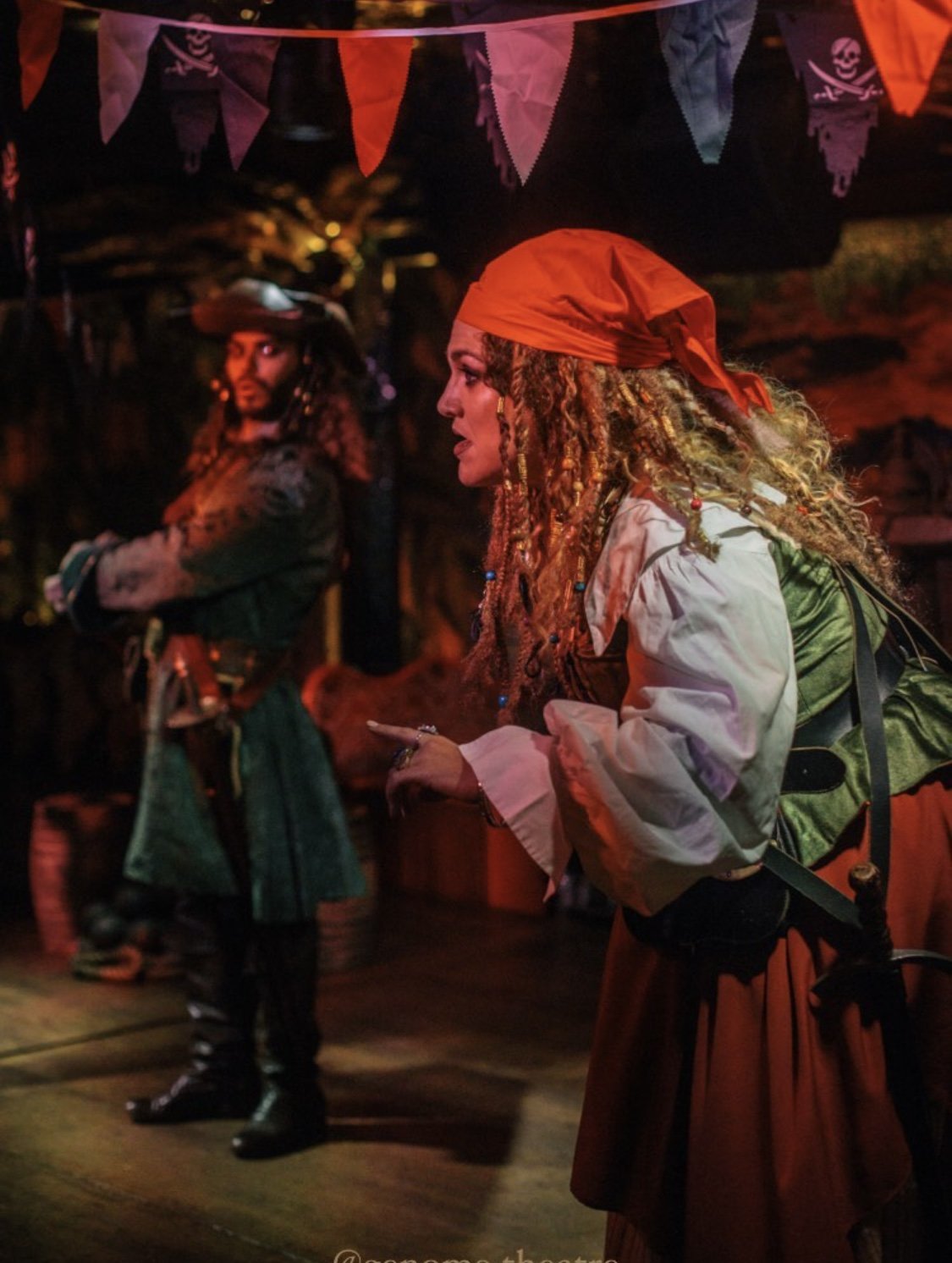 Pirate-themed performance with actors in costume.