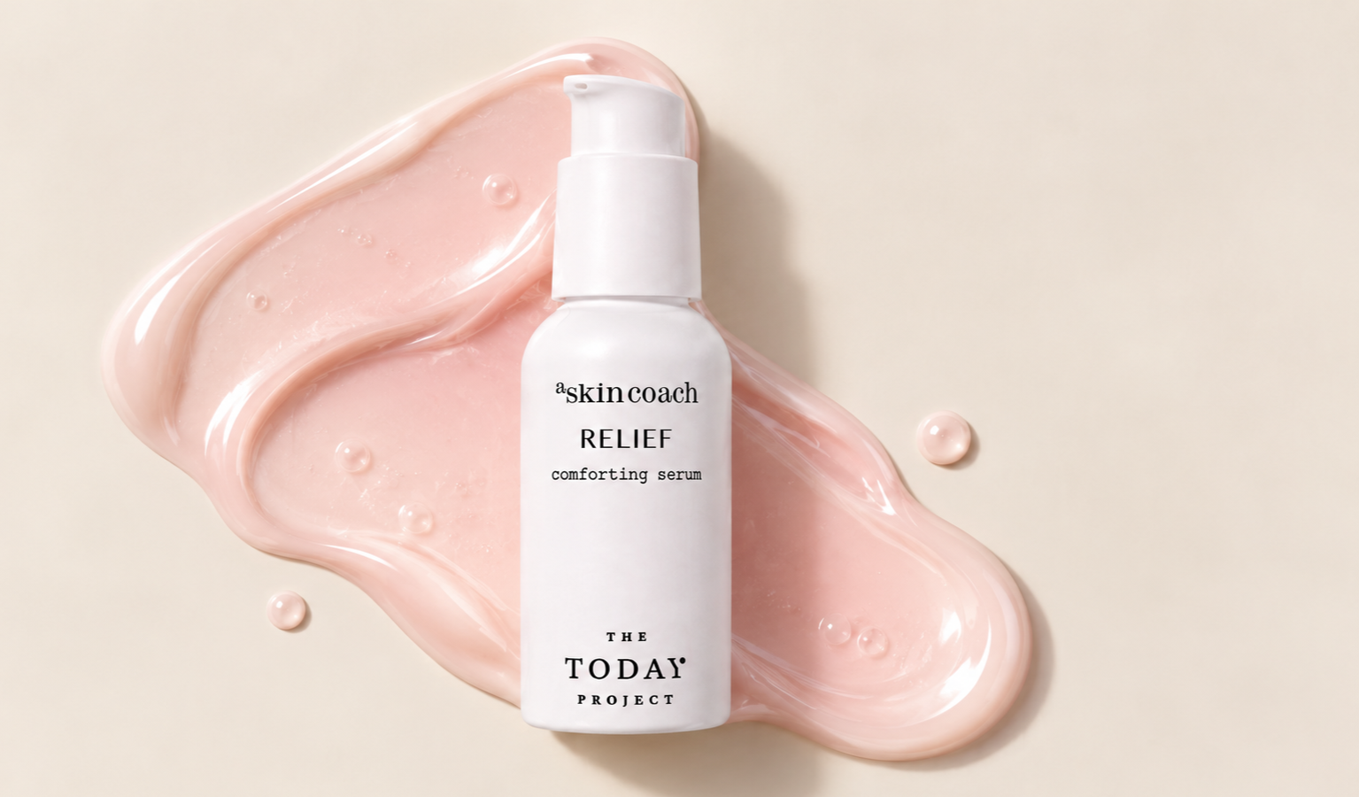 Bottle of 'skinceach RELIEF comforting serum' on a beige background with pink serum smeared around it.