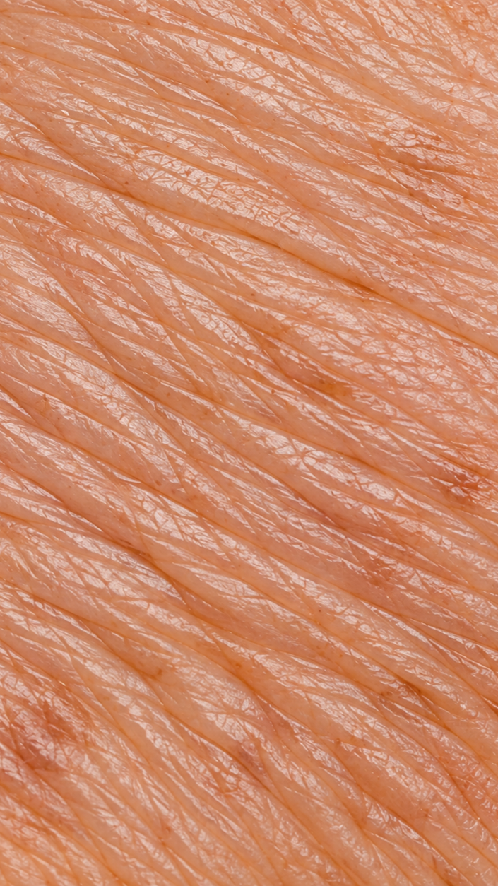 Close-up of raw salmon flesh showing pink-orange color and natural striations.