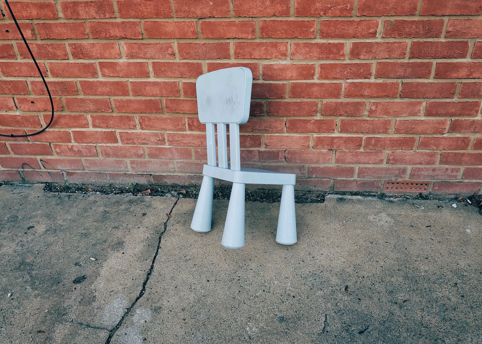Broken little blue chair