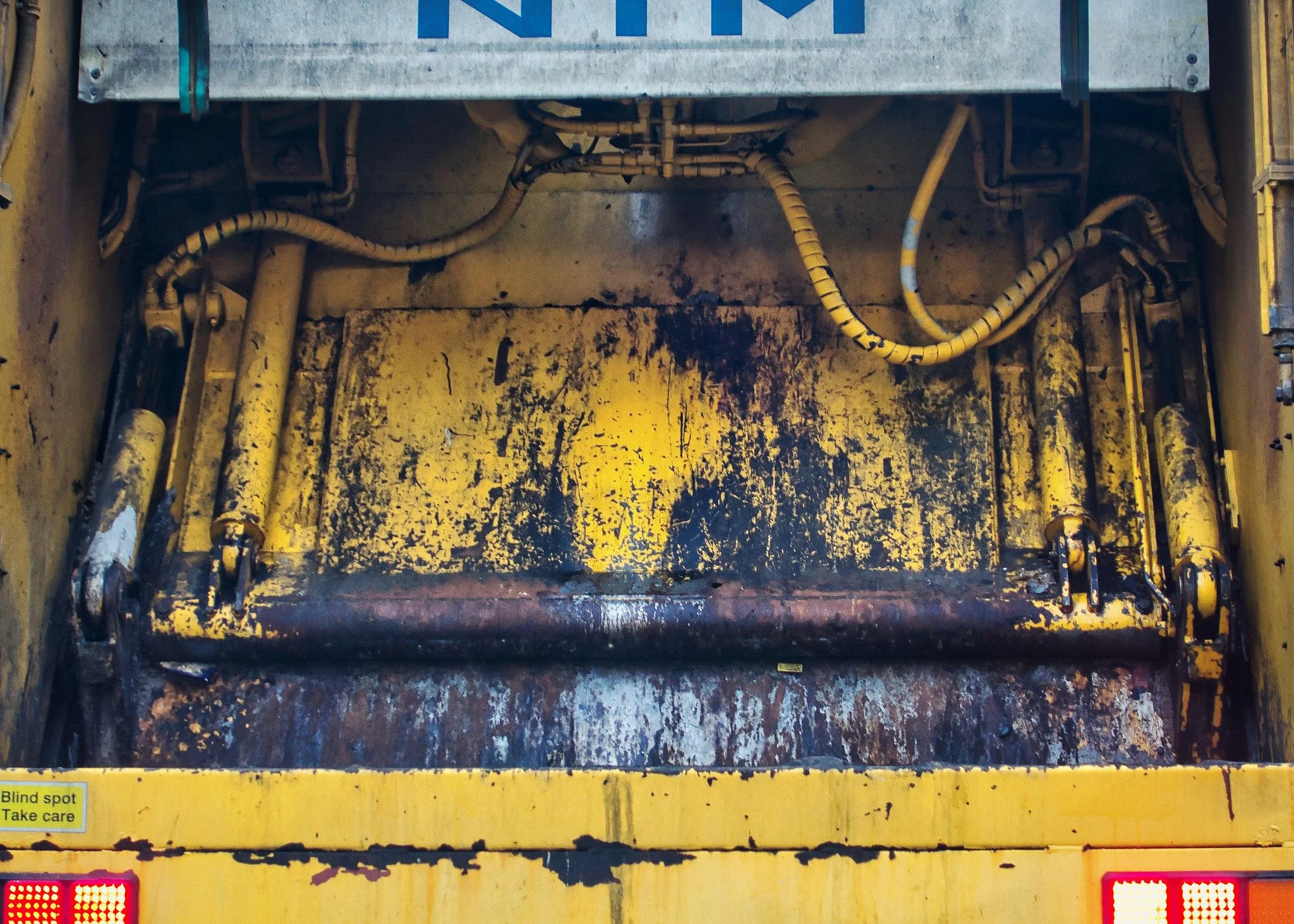 Yellow refuse truck (bin lorry)
