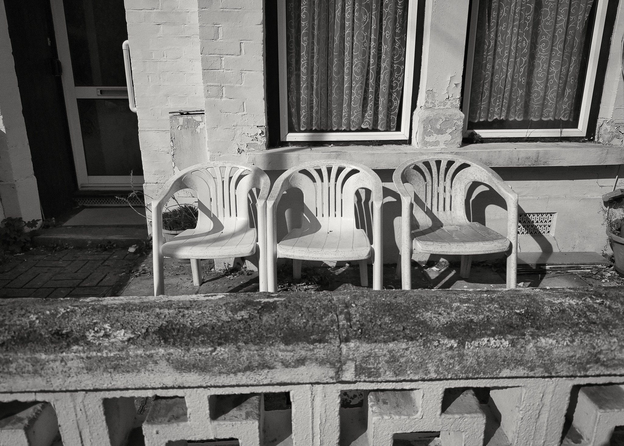 Three plastic chairs