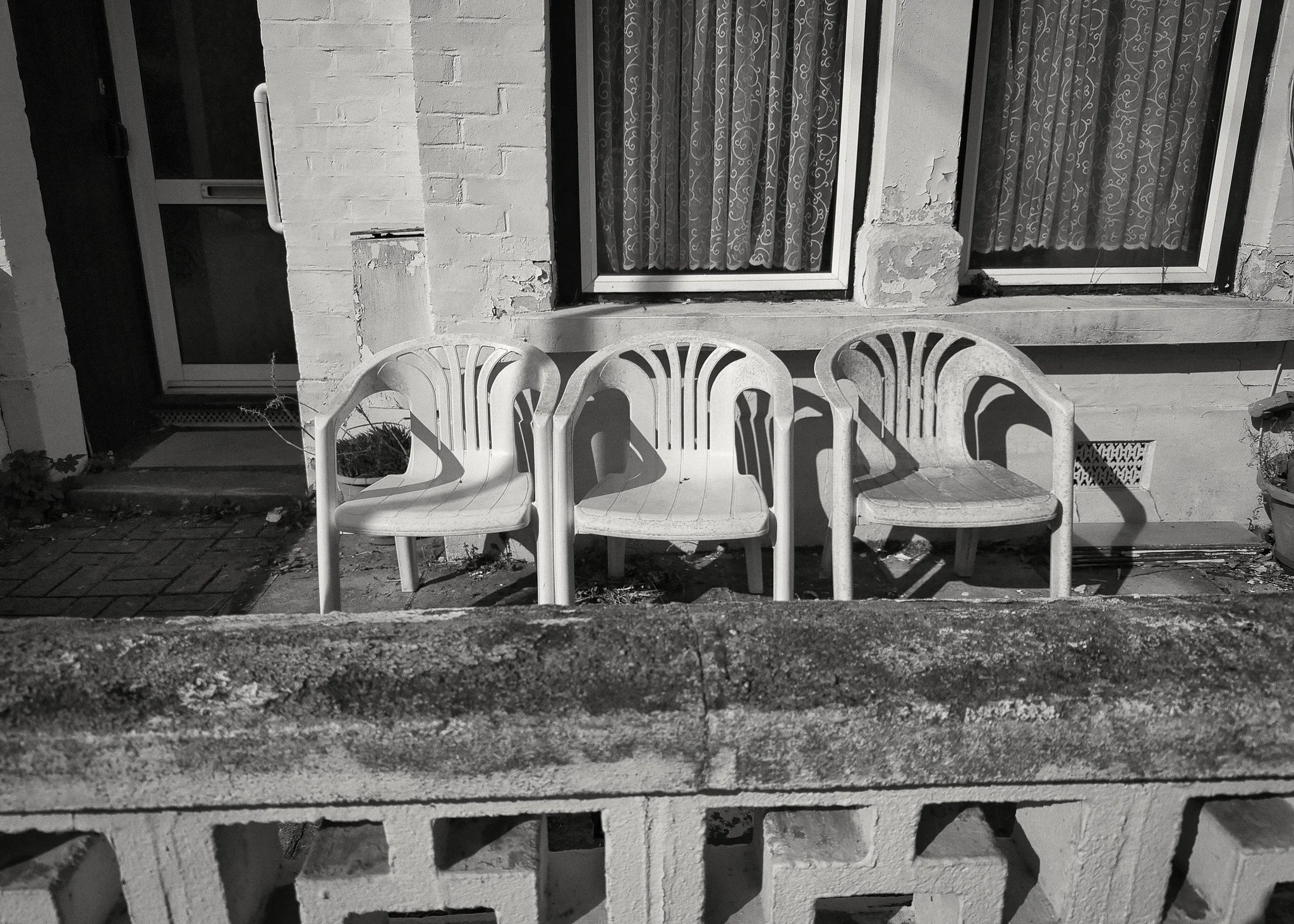 Three plastic chairs