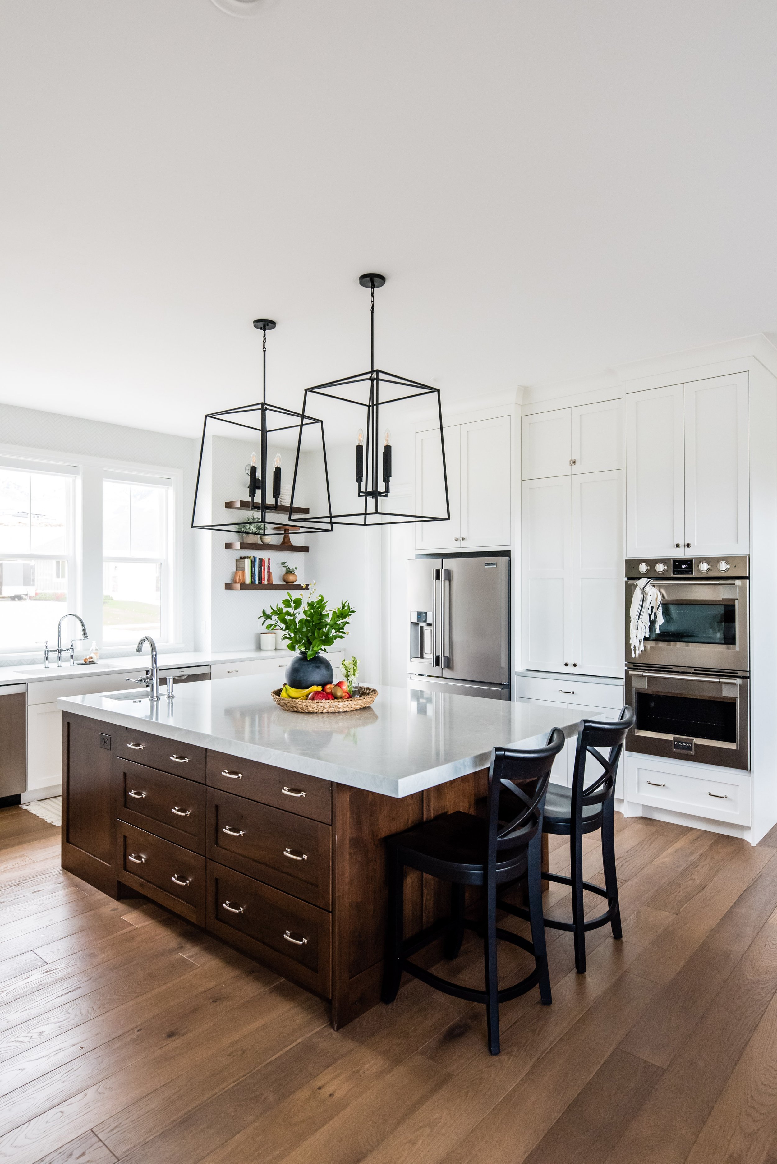  Picking natural wood cabinets for your kitchen island with white cabinets in the kitchen by Liz Powell Design. modern feel kitchen big new kitchen #LizPowellDesign #InteriorDesignUtah #InteriorDesigner #buildingahome #cabinetry #dreamhome #interiors