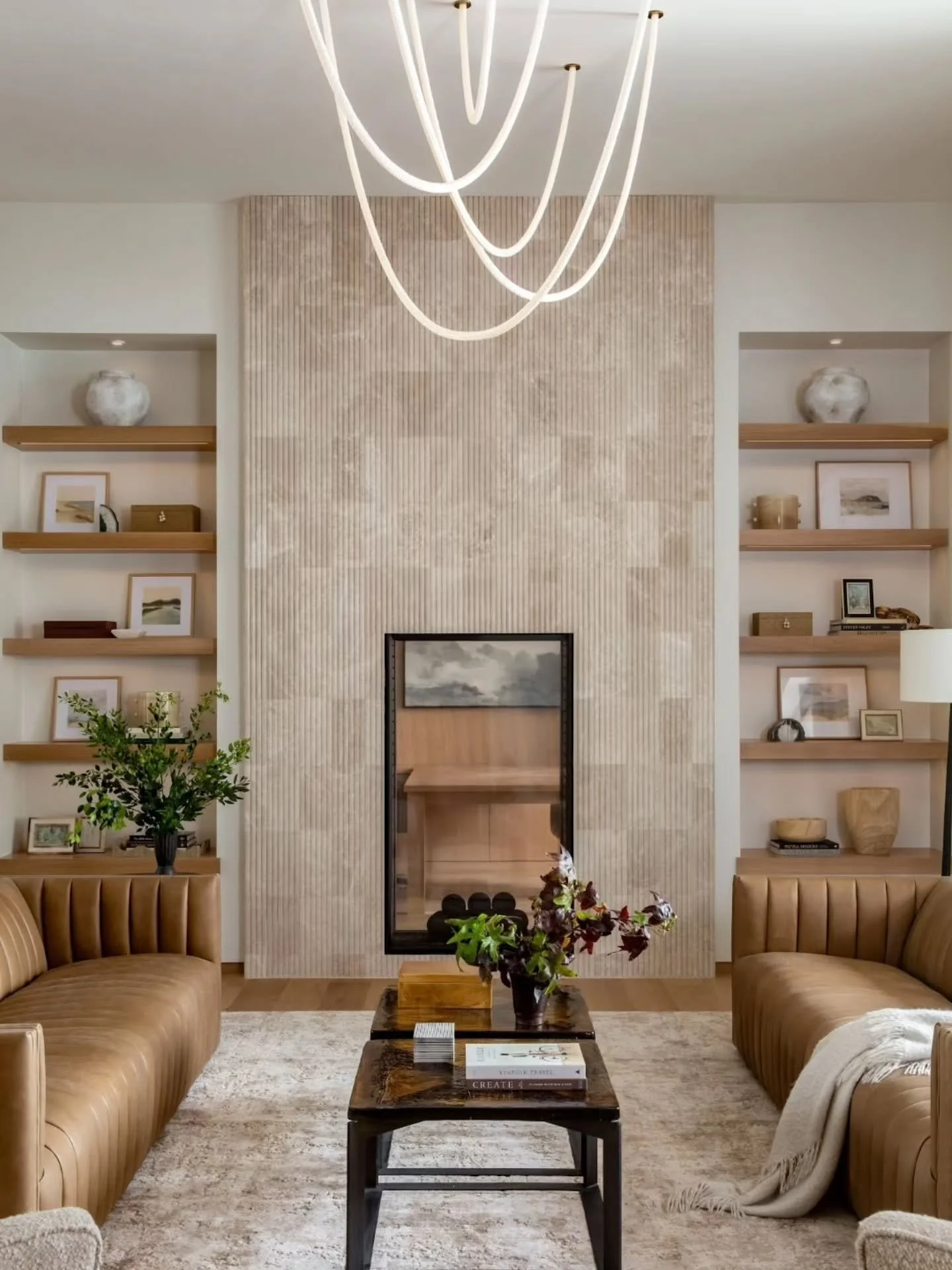 Who knew a neutral palette could also have this much wow!! 
Stone, glass, wood, leather, and killer lighting make this a room you don't want to leave!

Design- @lizpowelldesign 
Contractor- @stone_gate_homes 
Photographer- @lindsay_salazar_photograph