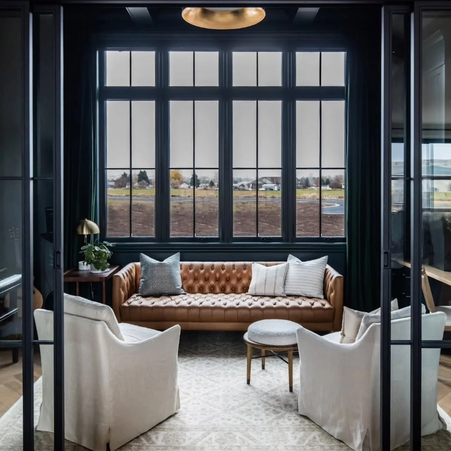 This moody flex space from our #pieceofparadise Project is one of my favorite rooms. We used a dark green paint to completely color drench the room. It boasts big, beautiful windows that let in the perfect natural light.

#moodyphotography
#moodyvibe