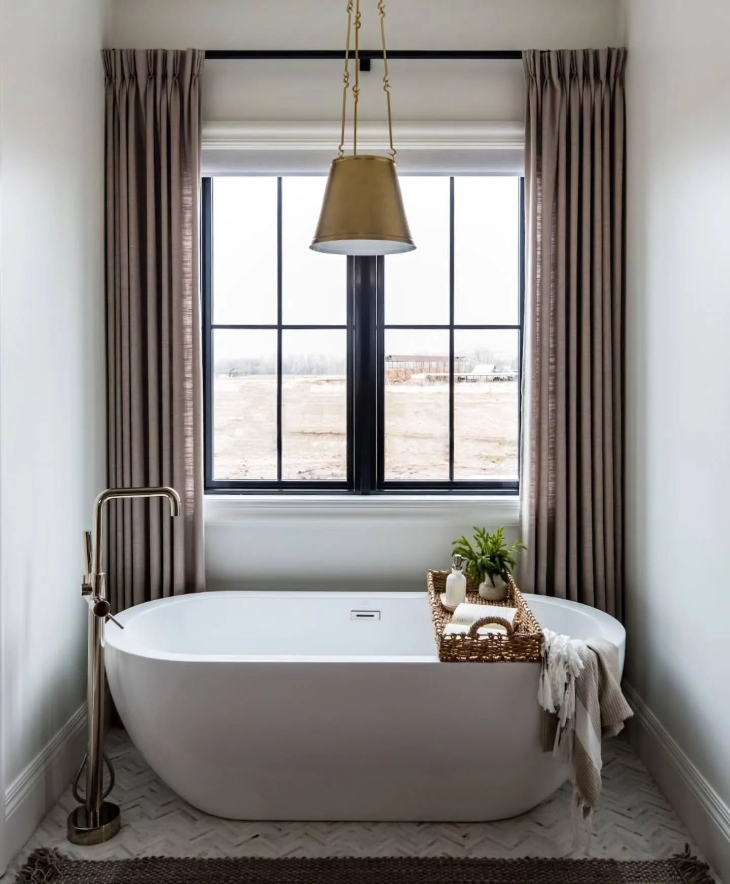 It's the small things that make this space special. If your tub needs some styling help, try these tips...

1.  Drapes or cafe curtains to add a layer of softness.
2. A rug with a fun pattern or texture
3. A tub tray. Add a plant, maybe some candles.
