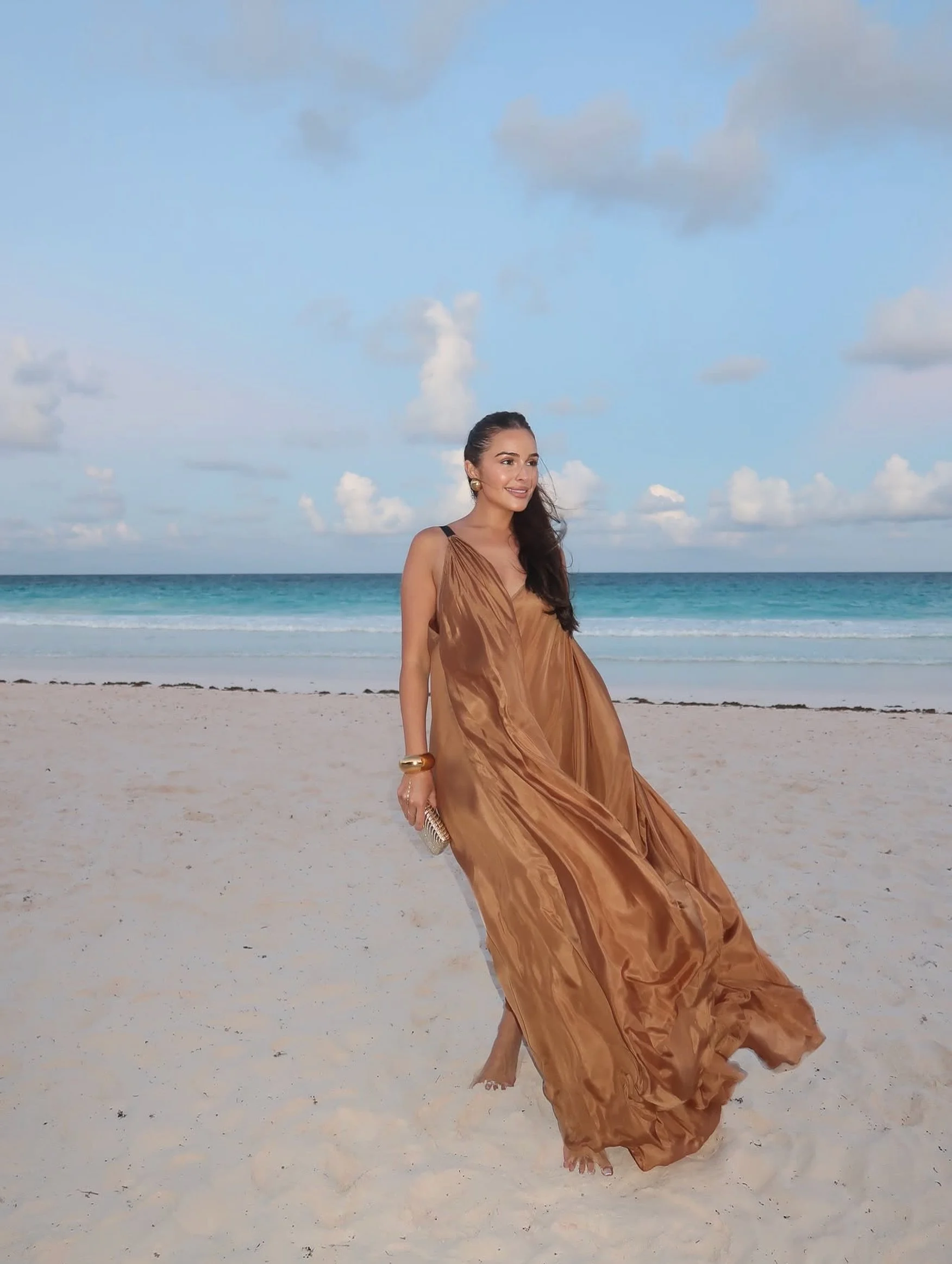@oliviaculpo wears the @temilyofficial Parachute Dress in Palo Santo 🤎