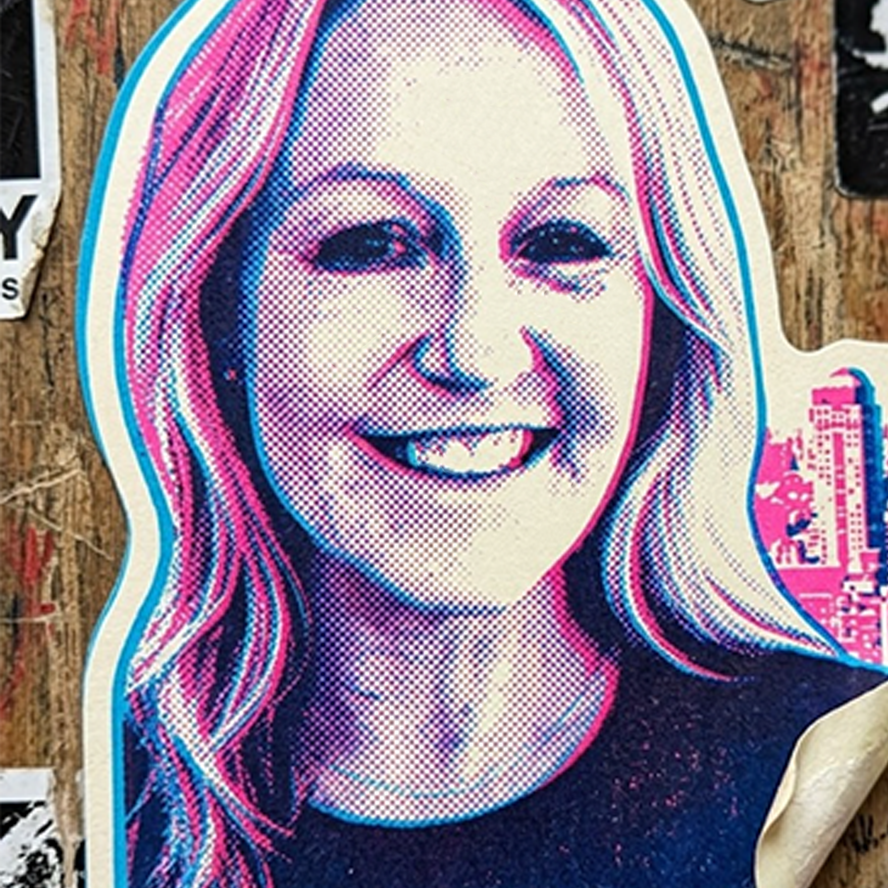 Pop art style portrait of a woman with blonde hair, smiling, with a dotted color pattern and vibrant pink, blue, and black colors.