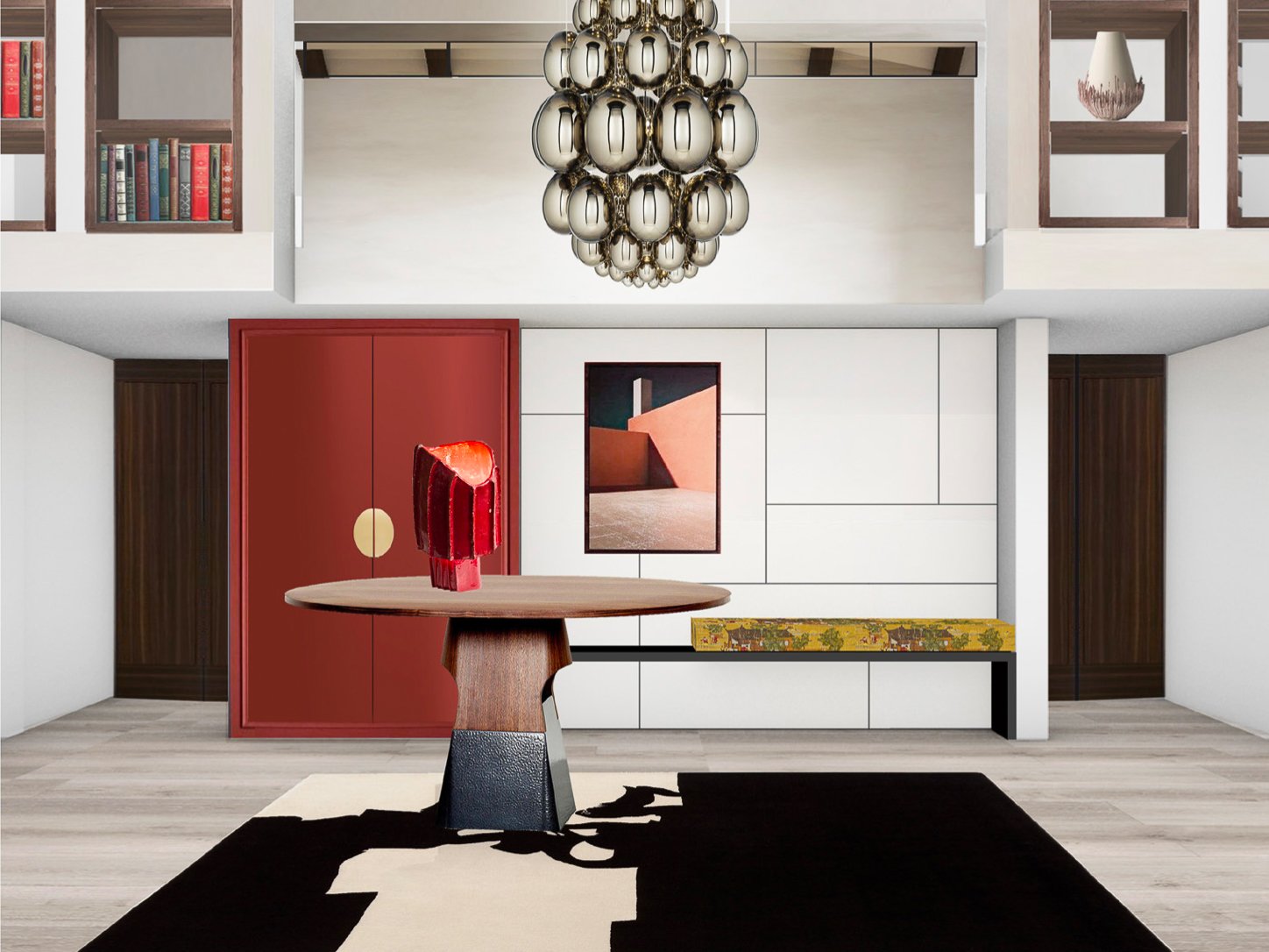 Modern living room with a round wooden table and red sculpture, white wall with framed art, chandelier made of metallic spheres, built-in shelves with books and decorative objects, and a black and white rug.