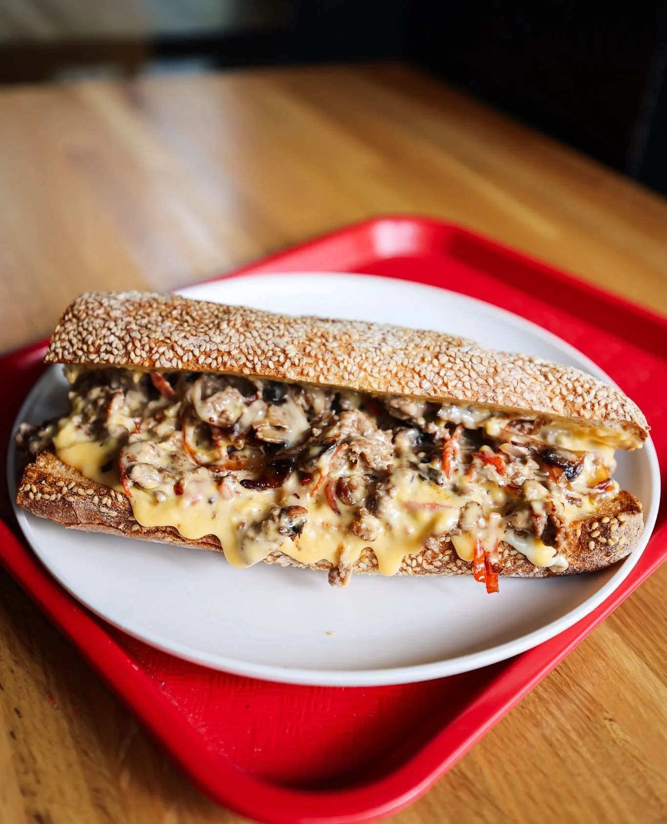 Make your lunch plans!! @mikeandpattys has officially launched the Philly Cheesesteak 🧀 + Chicken Parm 🍗 subs at their Bow Market location only. The seeded bread is baked in-house. These Italian-American classics are bringing all the cheesy, juicy,