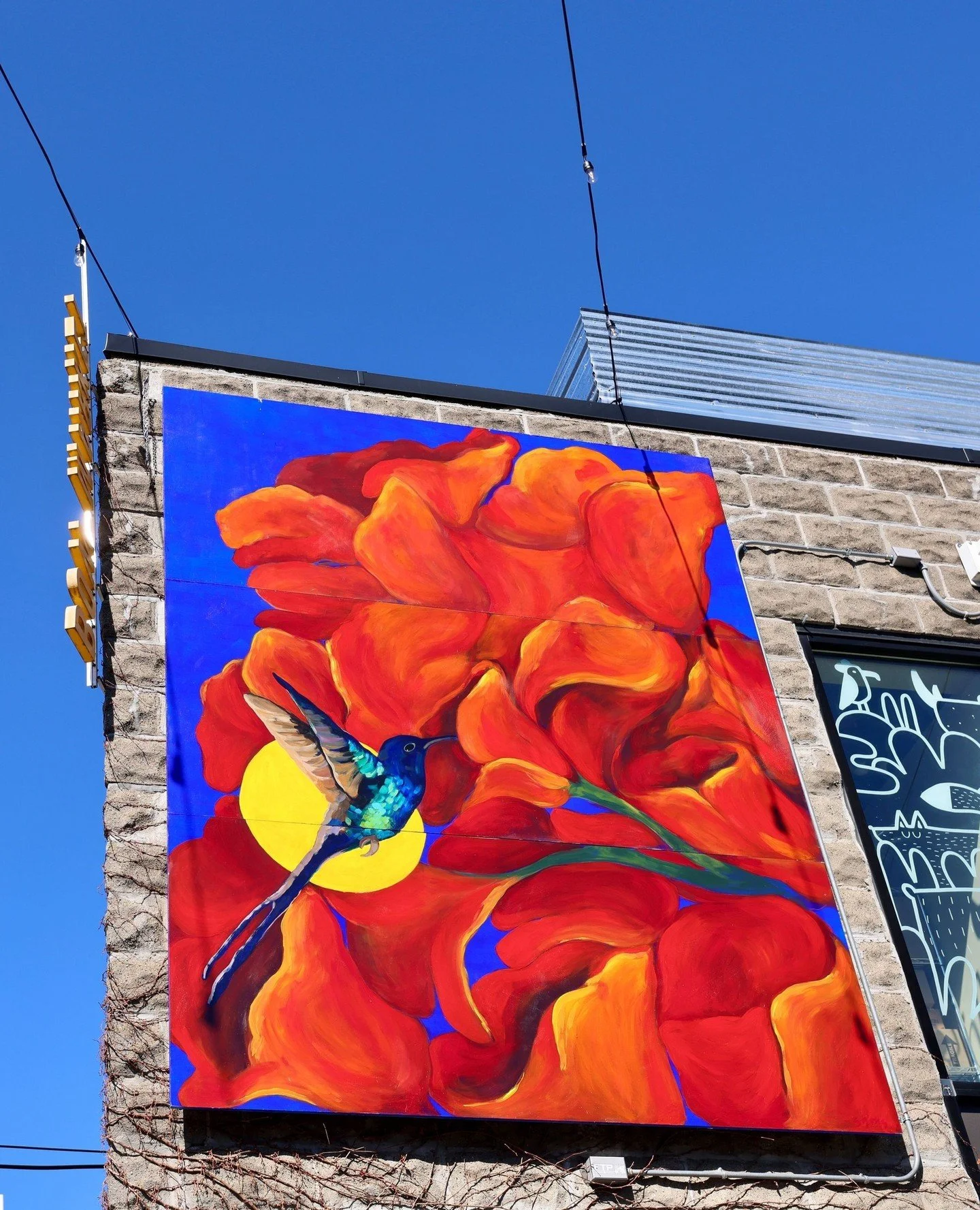 El Baile del Colibr&Iacute; (The Dance of the Hummingbird) by Sabrina Gonzalez truly shines all year long in our courtyard!