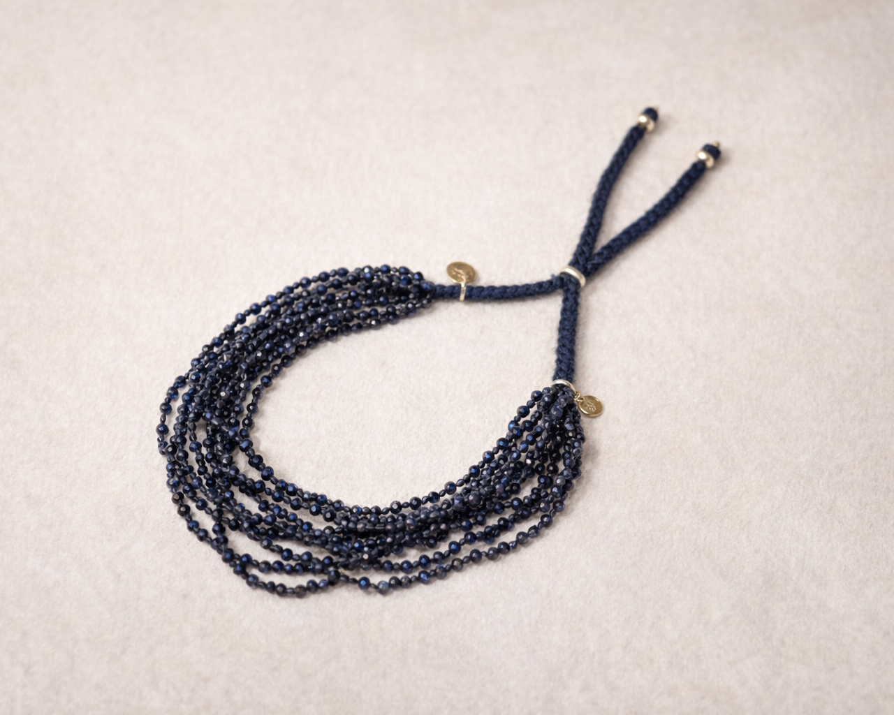 9-Strand-Blue-Sapphire-Bracelet-Product-Shot.jpg.png