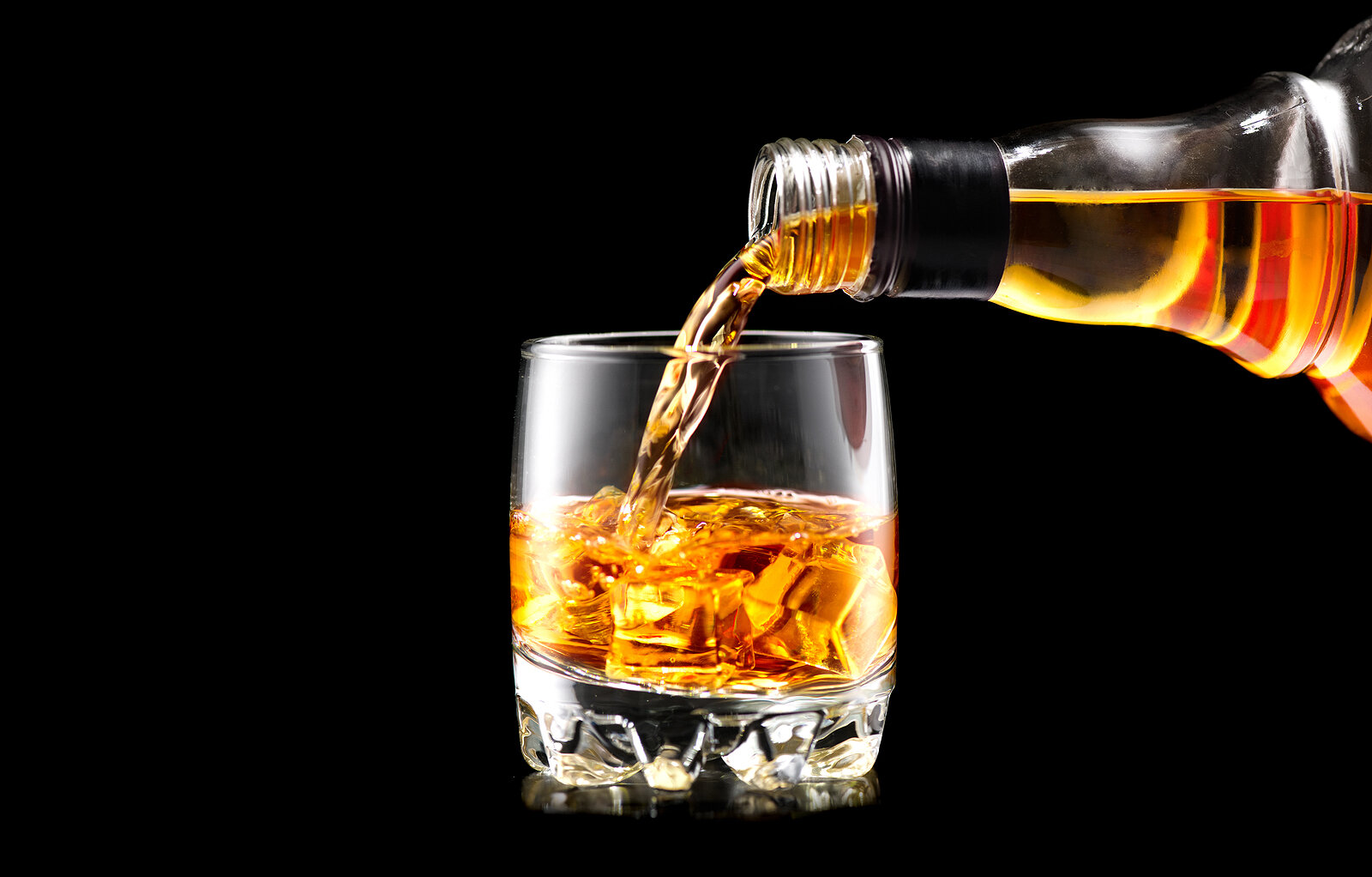 bigstock-Whiskey-with-ice-Pouring-whis-213581107 (2).jpg