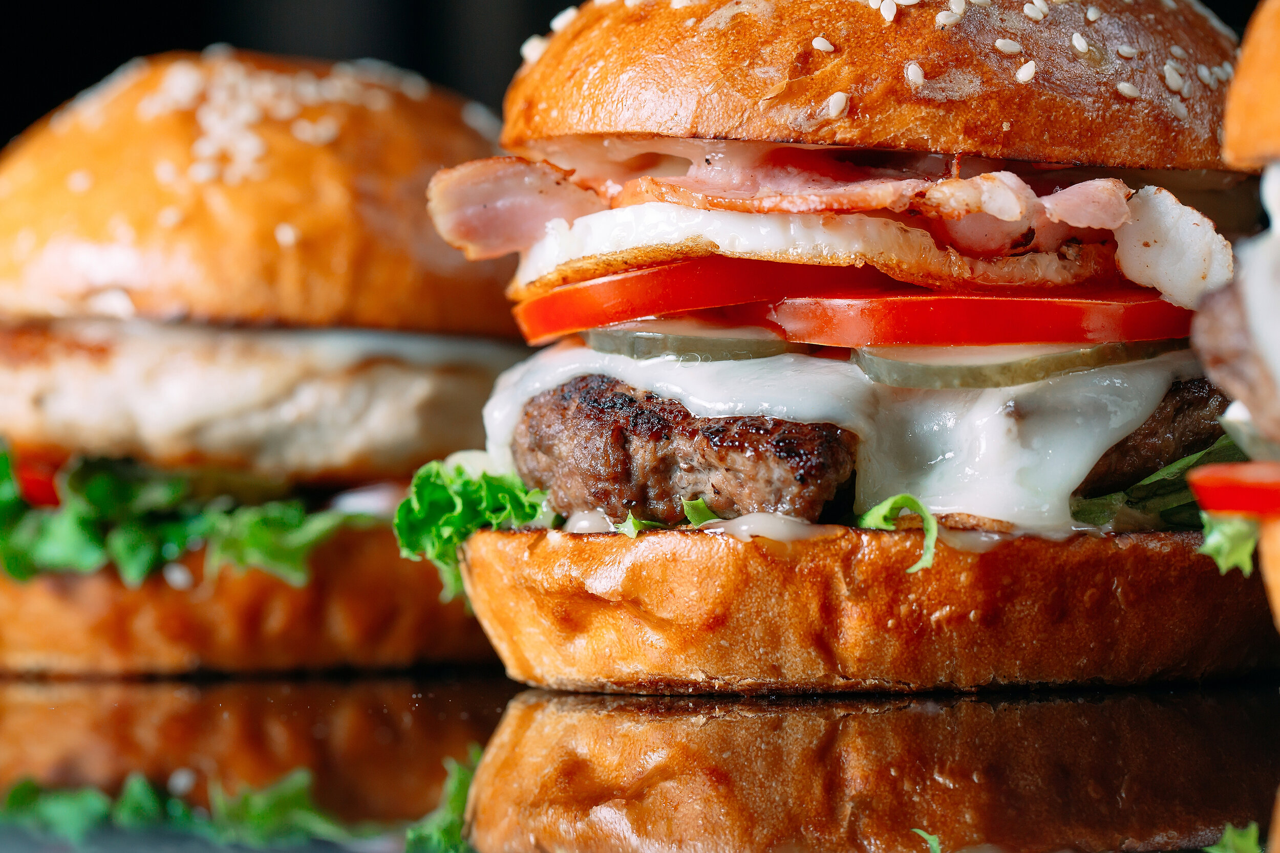 bigstock-Juicy-Beef-Burgers-On-A-Black--382602848.jpg