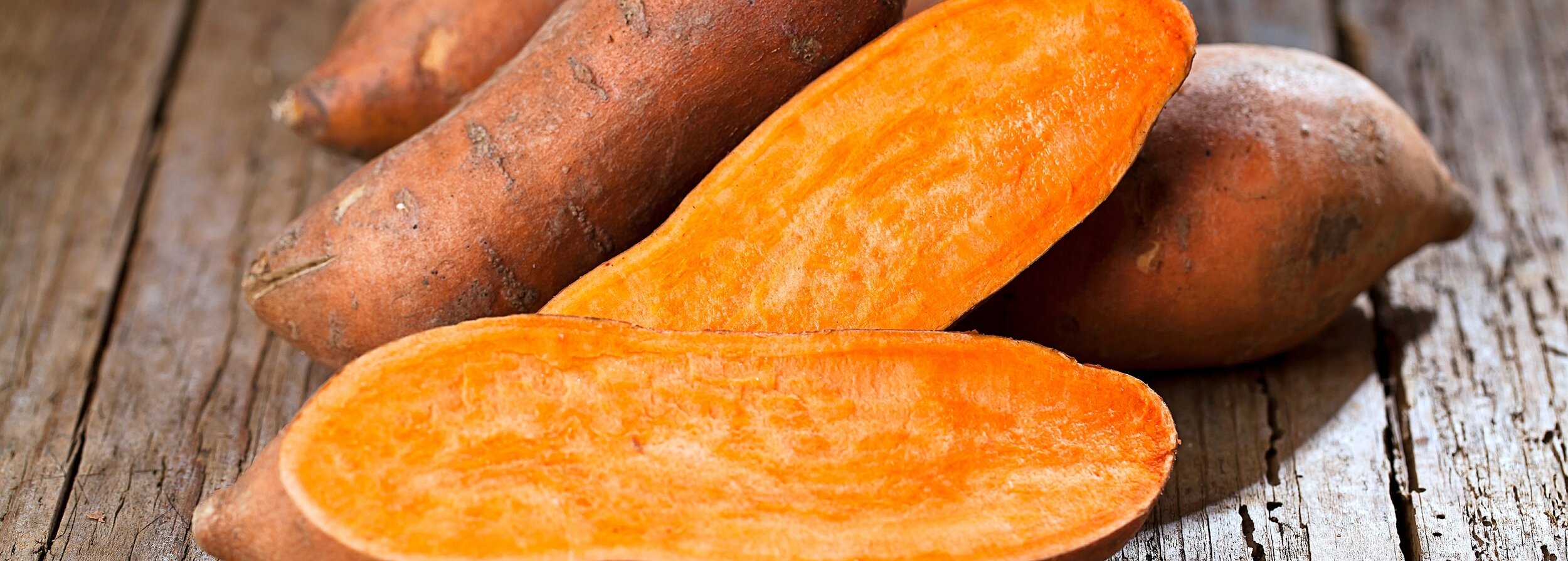 bigstock-Raw-Sweet-Potatoes-On-Wooden-B-270389875.jpg