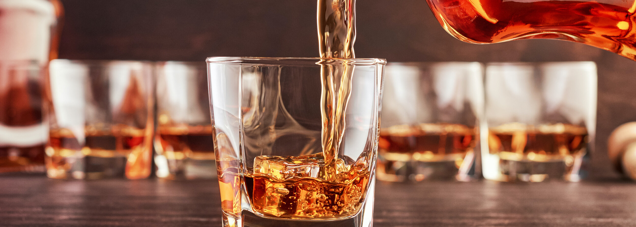 bigstock-A-Glass-Of-Whiskey-On-A-Wooden-317701267.jpg