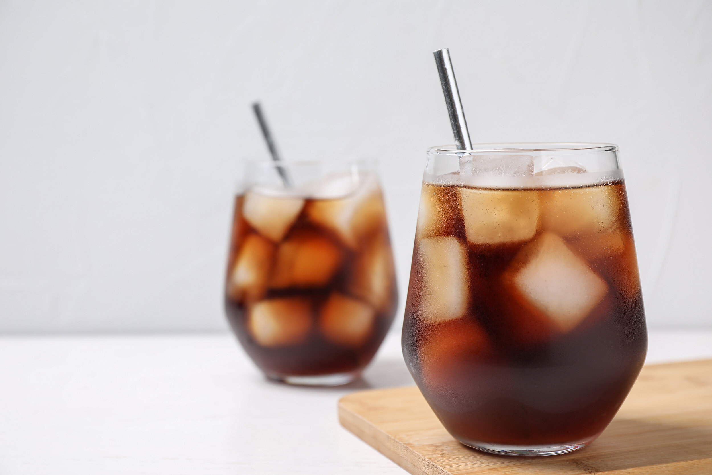 bigstock-Glass-Of-Tasty-Cola-With-Ice-C-408348629 (2).jpg