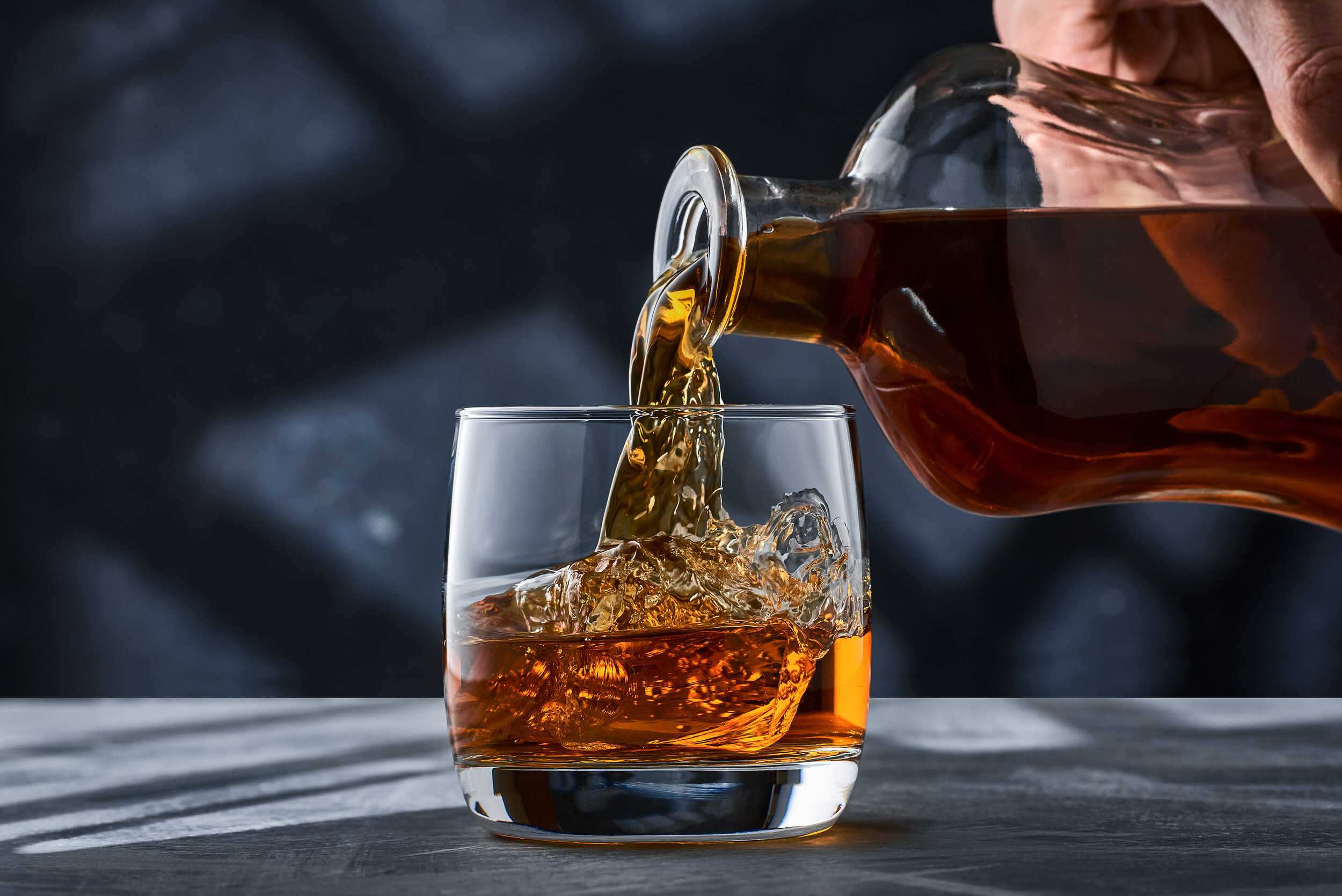 bigstock-Round-Glass-Of-Whiskey-With-Ic-393588704 (1).jpg