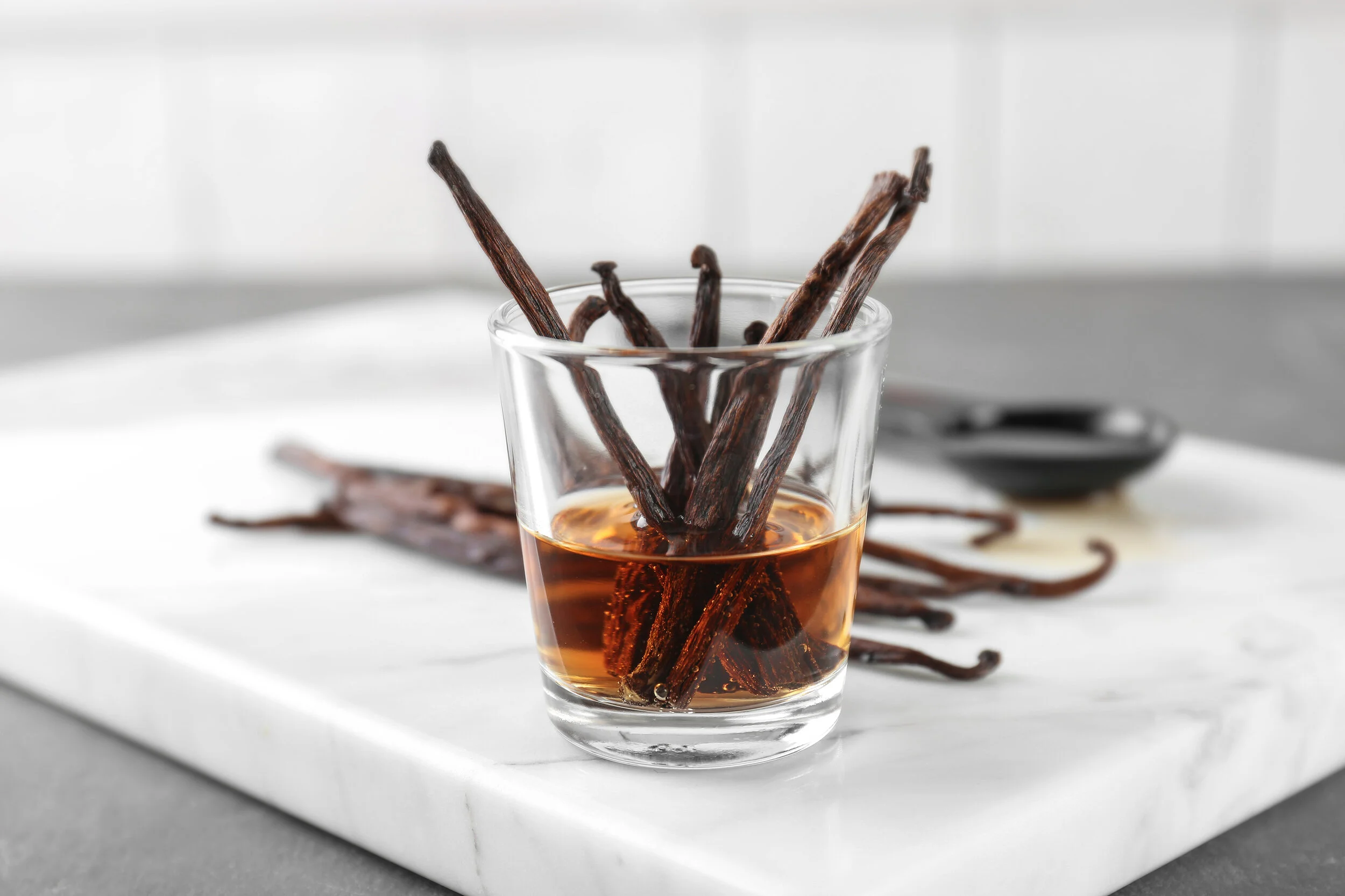 bigstock-Glass-with-vanilla-extract-and-228739828.jpg
