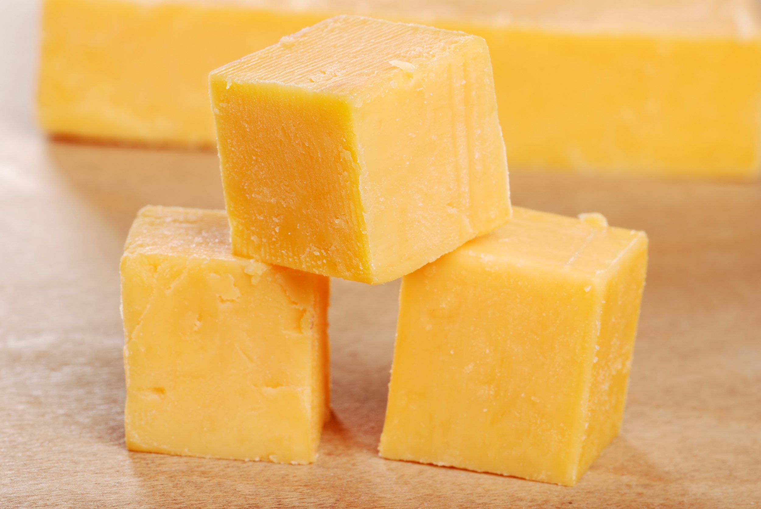 bigstock-Cheddar-Cheese-Cubes-Shallow-D-7057088 (1).jpg