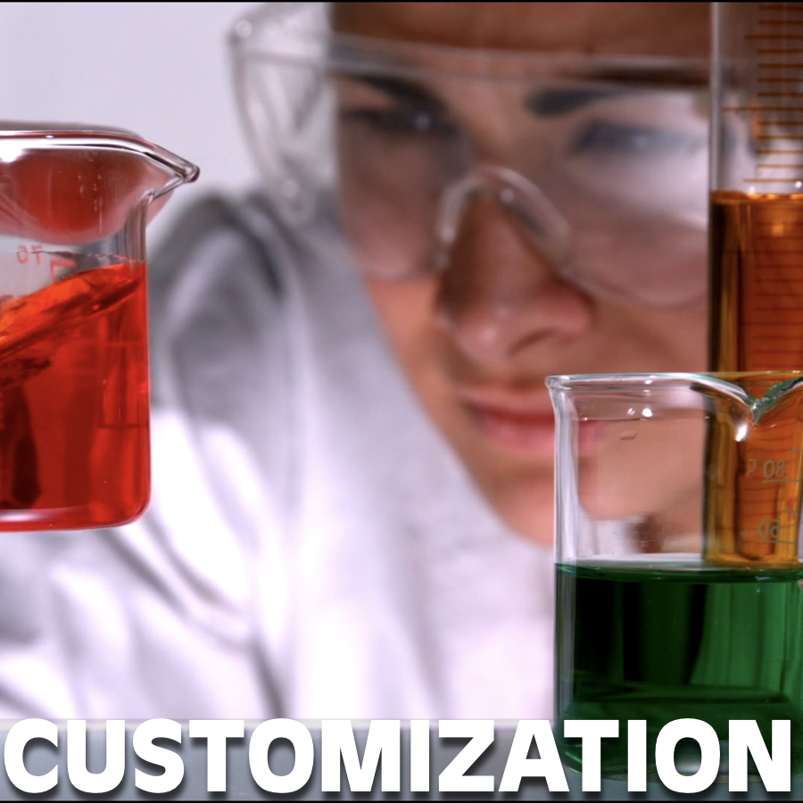 Scientist looking at beaker with chemical