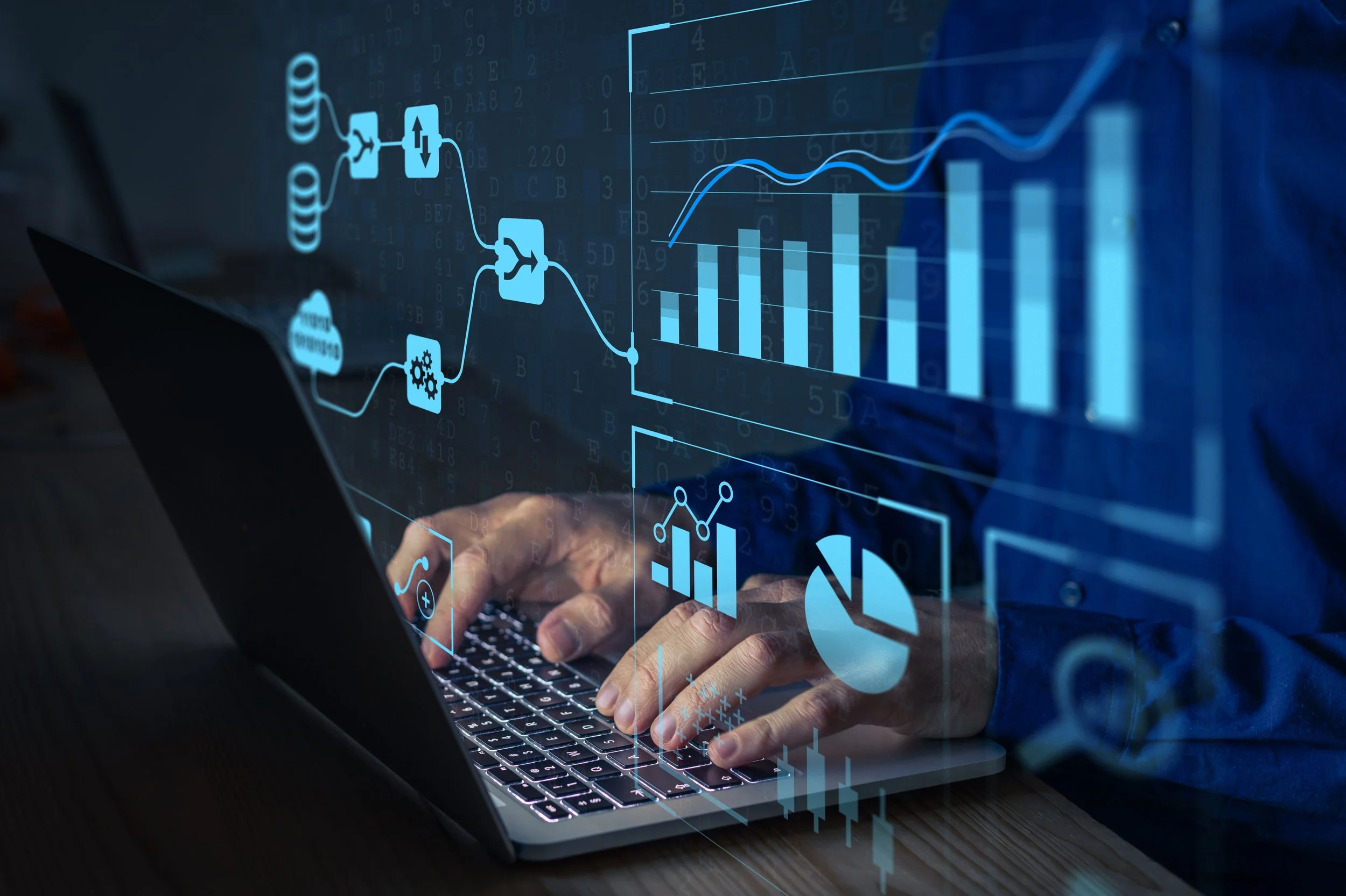 Project Manager working on laptop with statistics and charts