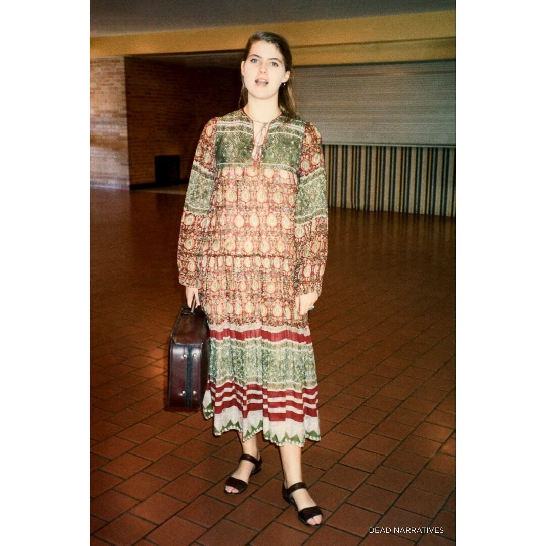 Meredith with her violin case in our high school hallway. MN, 1988.

**